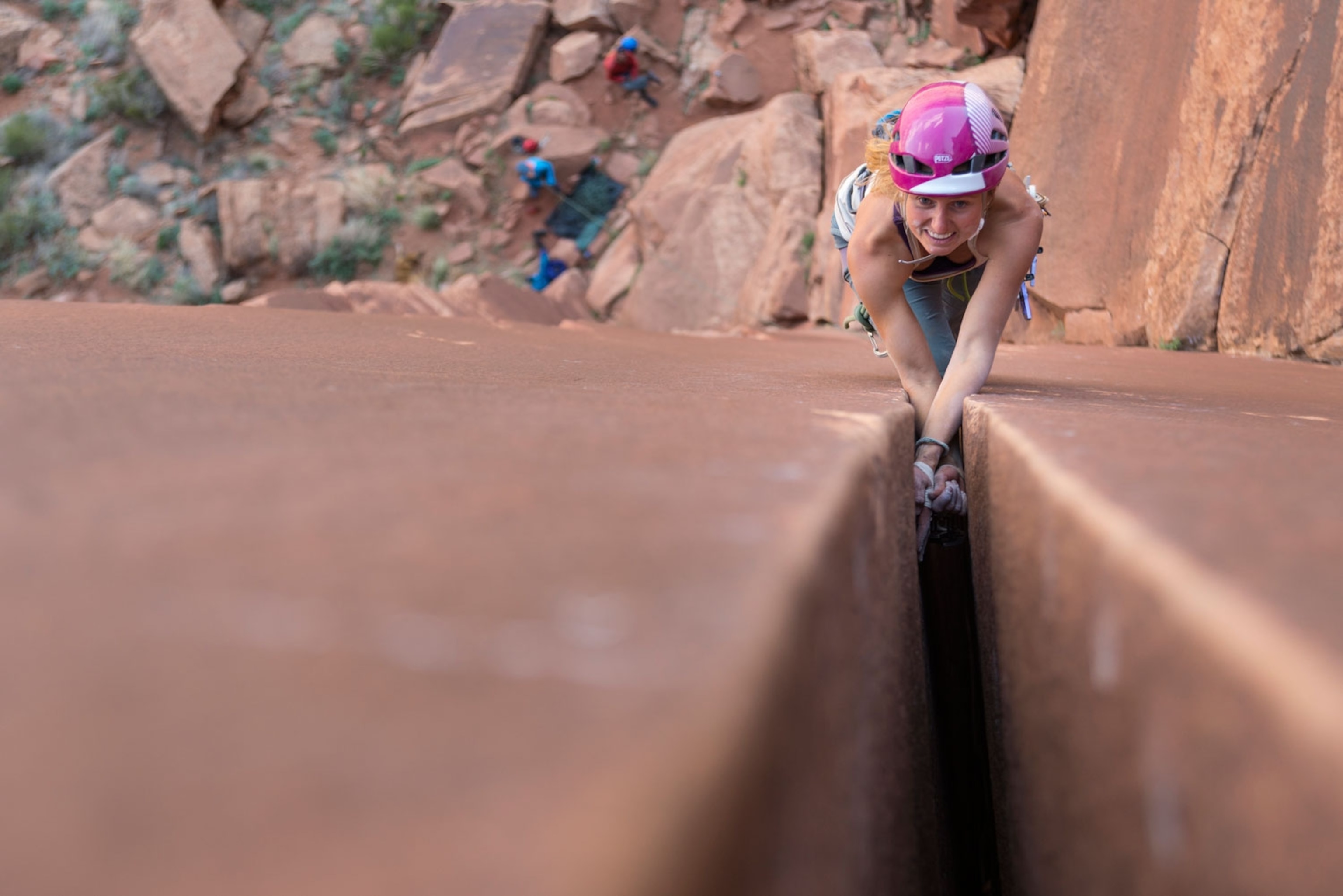 Brette Harrington climbing a wide crack in Indian Creek