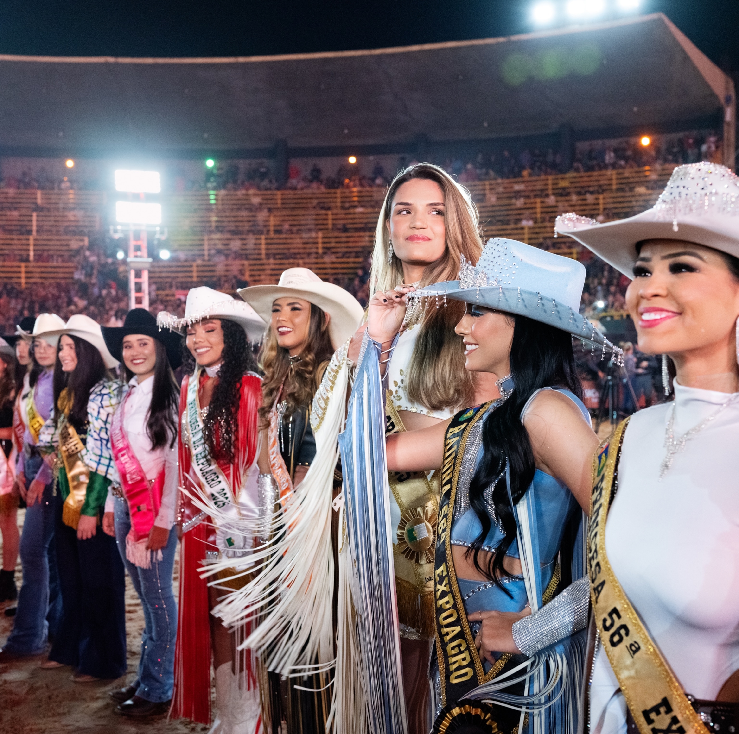 The outgoing 2024 queen and two princesses of the court line up.