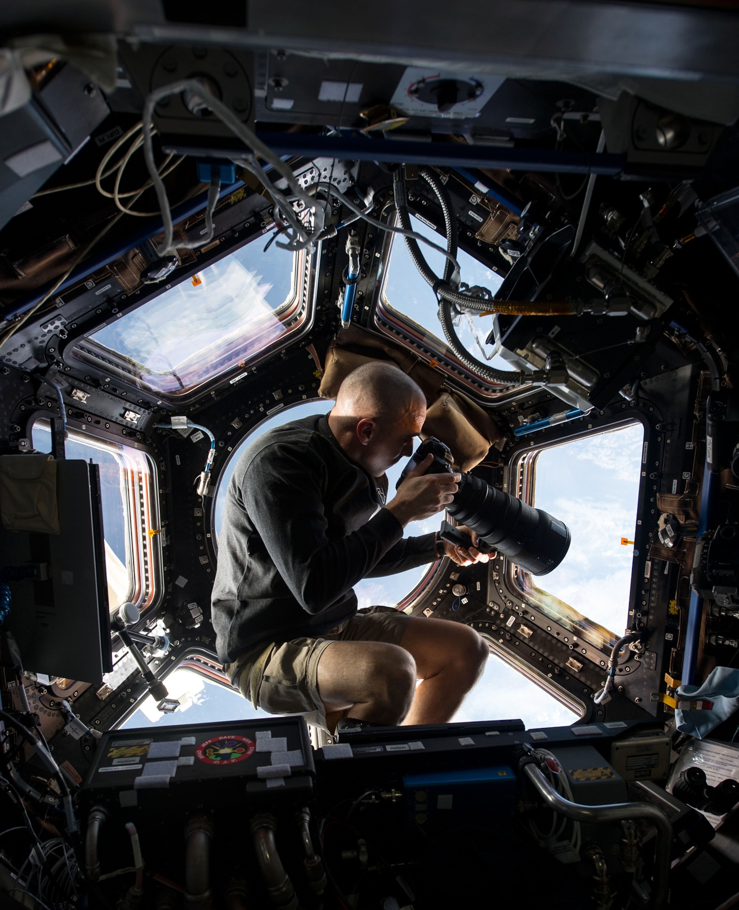 Astronaut Chris Cassidy taking photos in the ISS