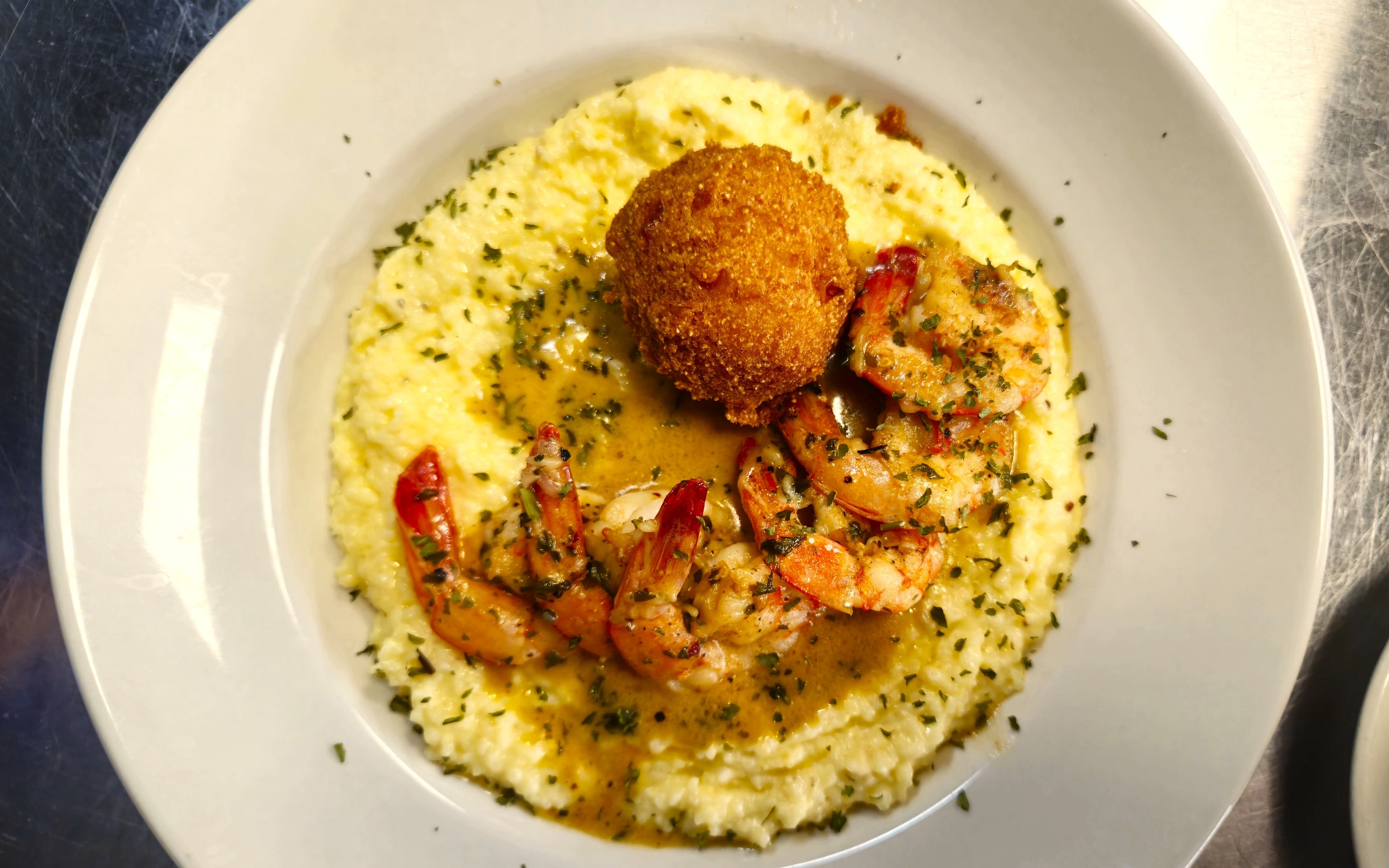 Caught straight from the Gulf, shrimp paired with grits is a staple of Cajun cuisine and can be found in most Louisianan restaurants.