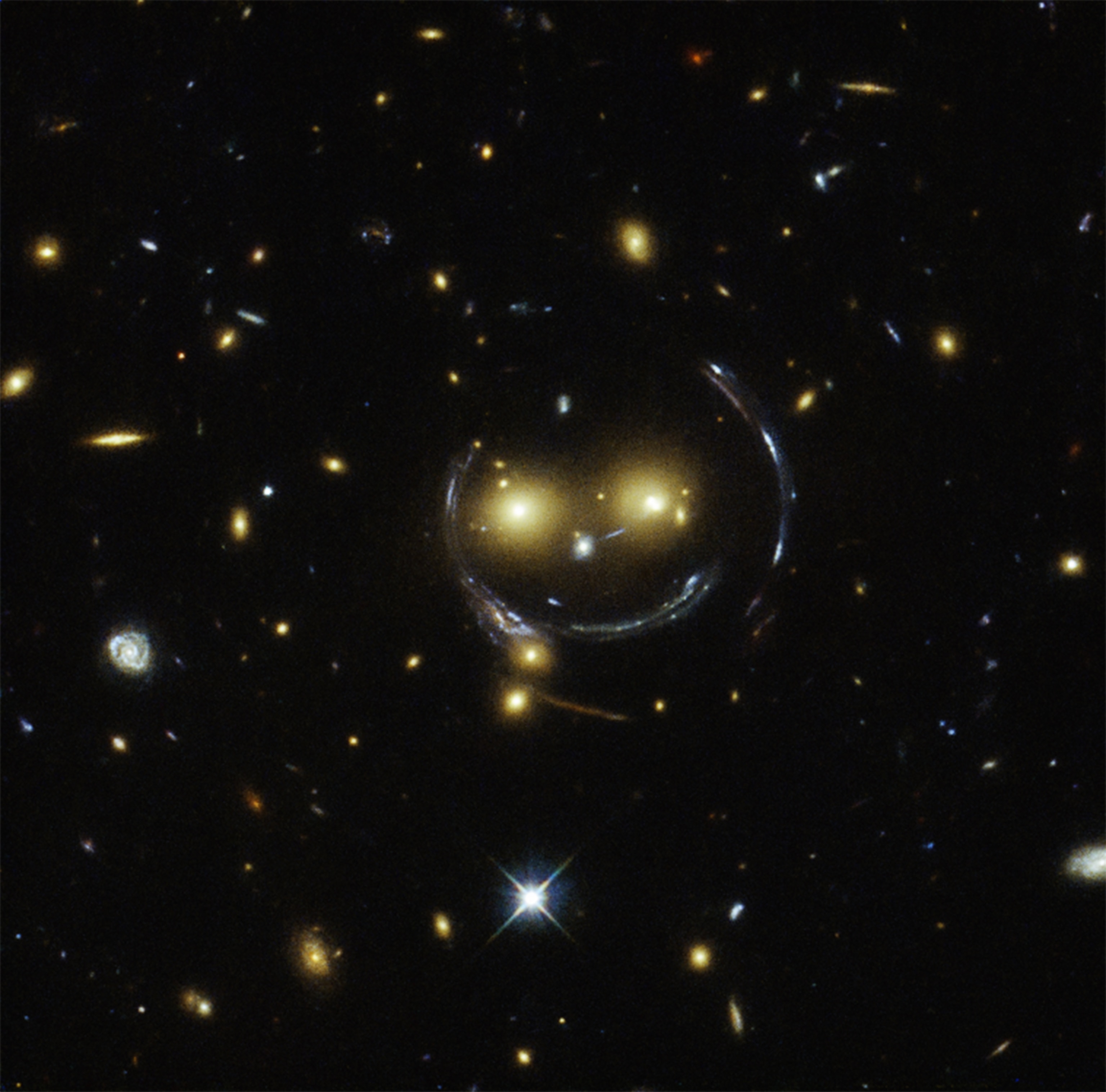 a galaxy cluster in the shape of a smiley face