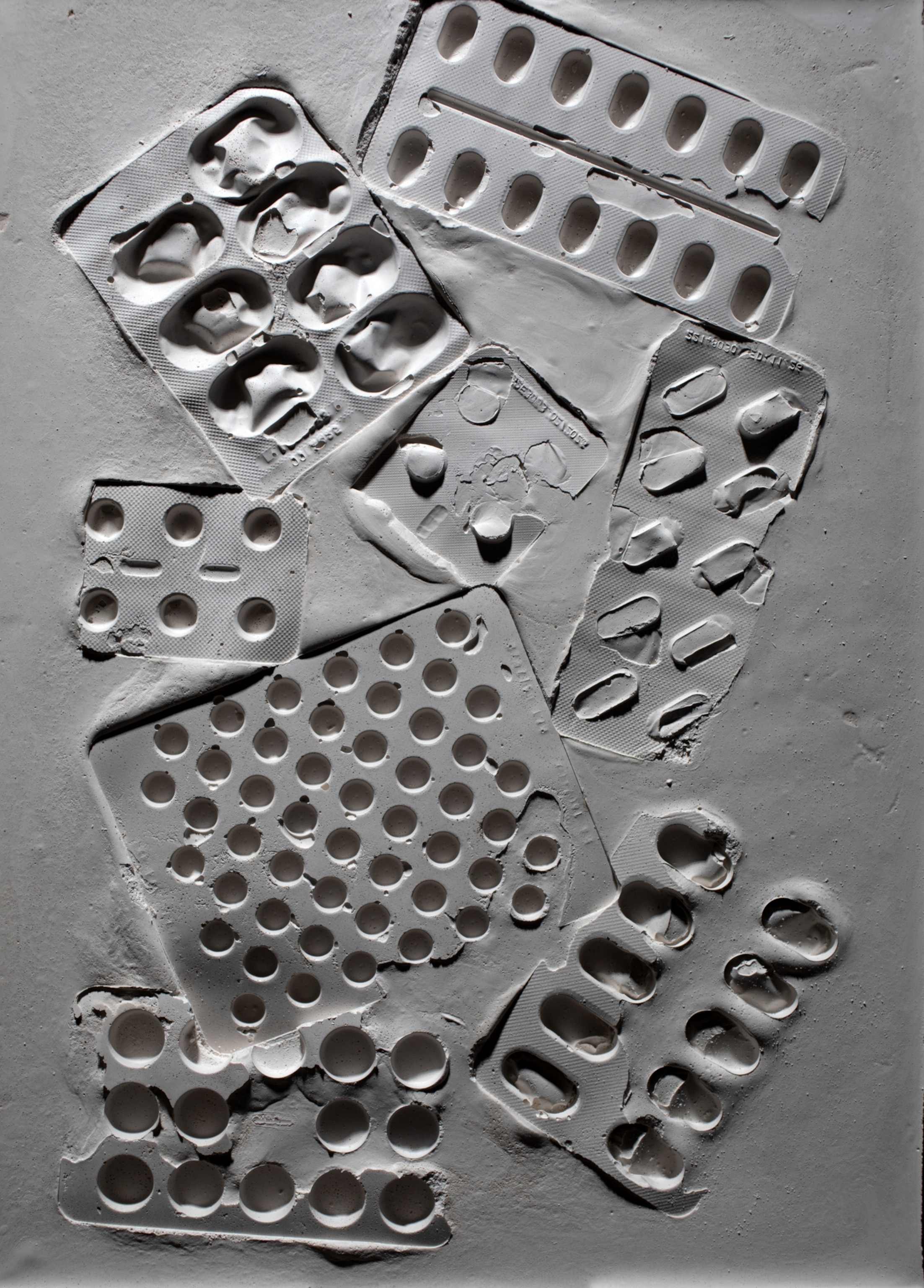 The imprints of pill blister packs left on a mock fossil