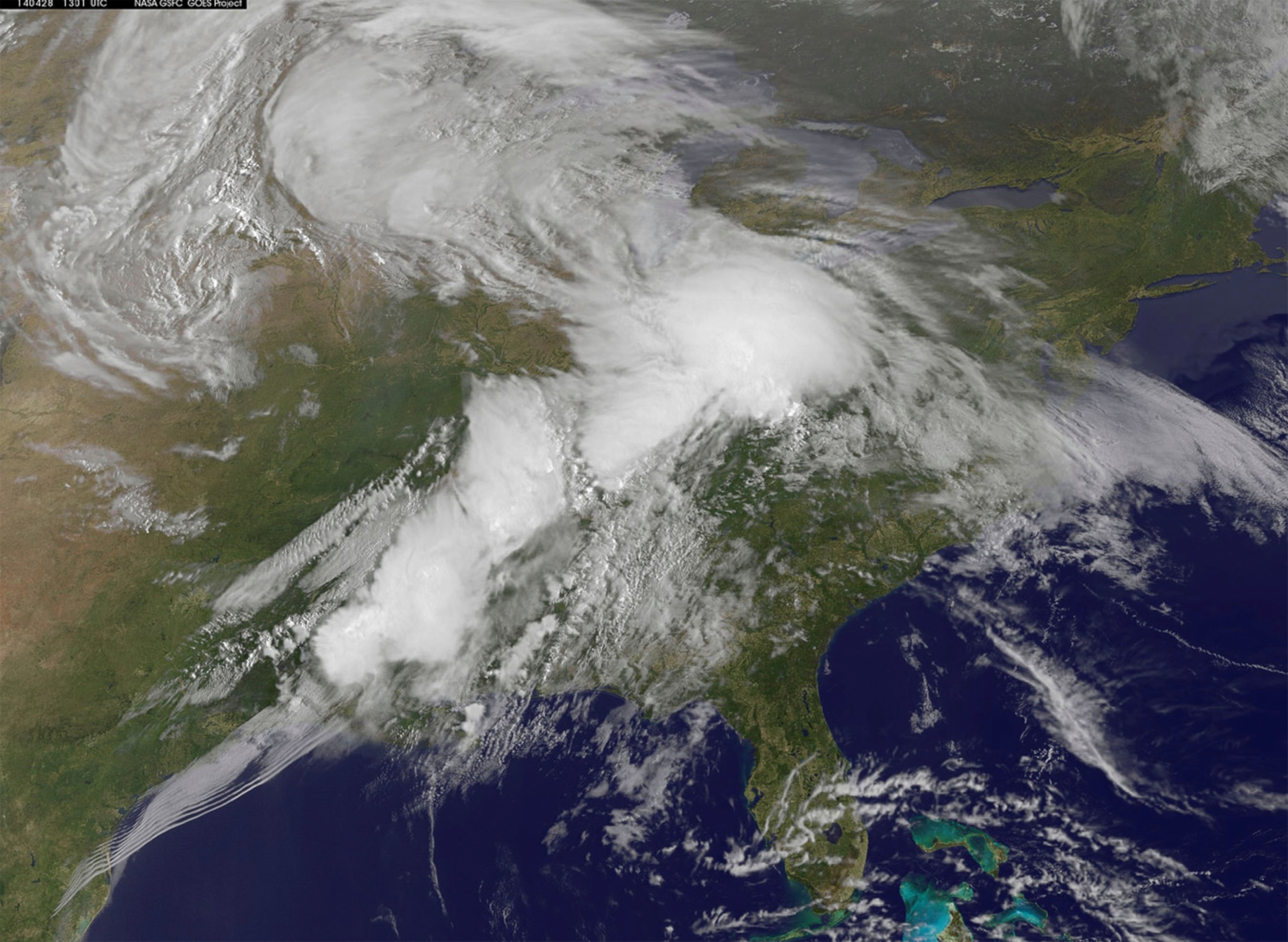 A satellite photo of a storm system moving east.