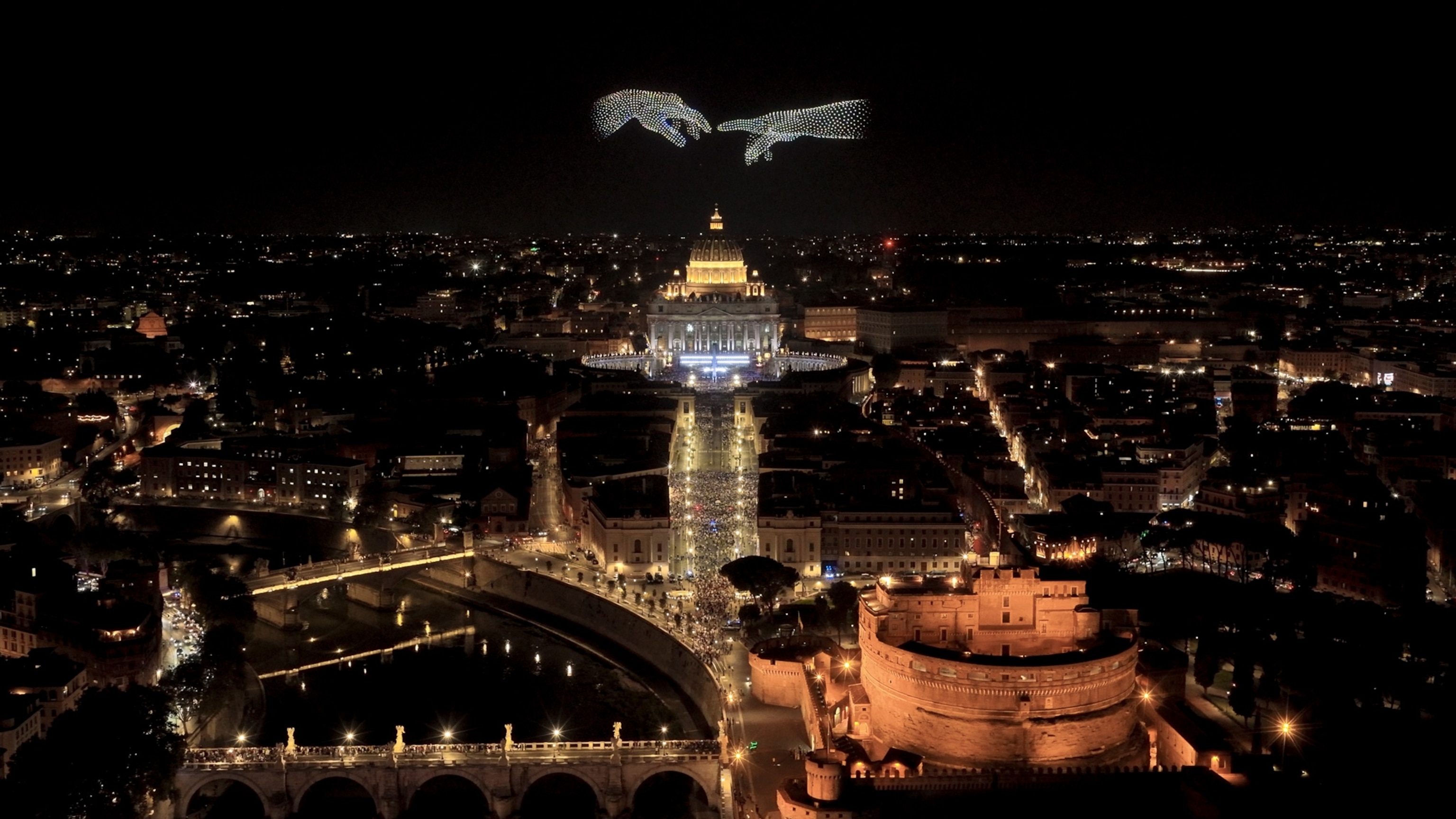 drones fly over the vatical lighting up