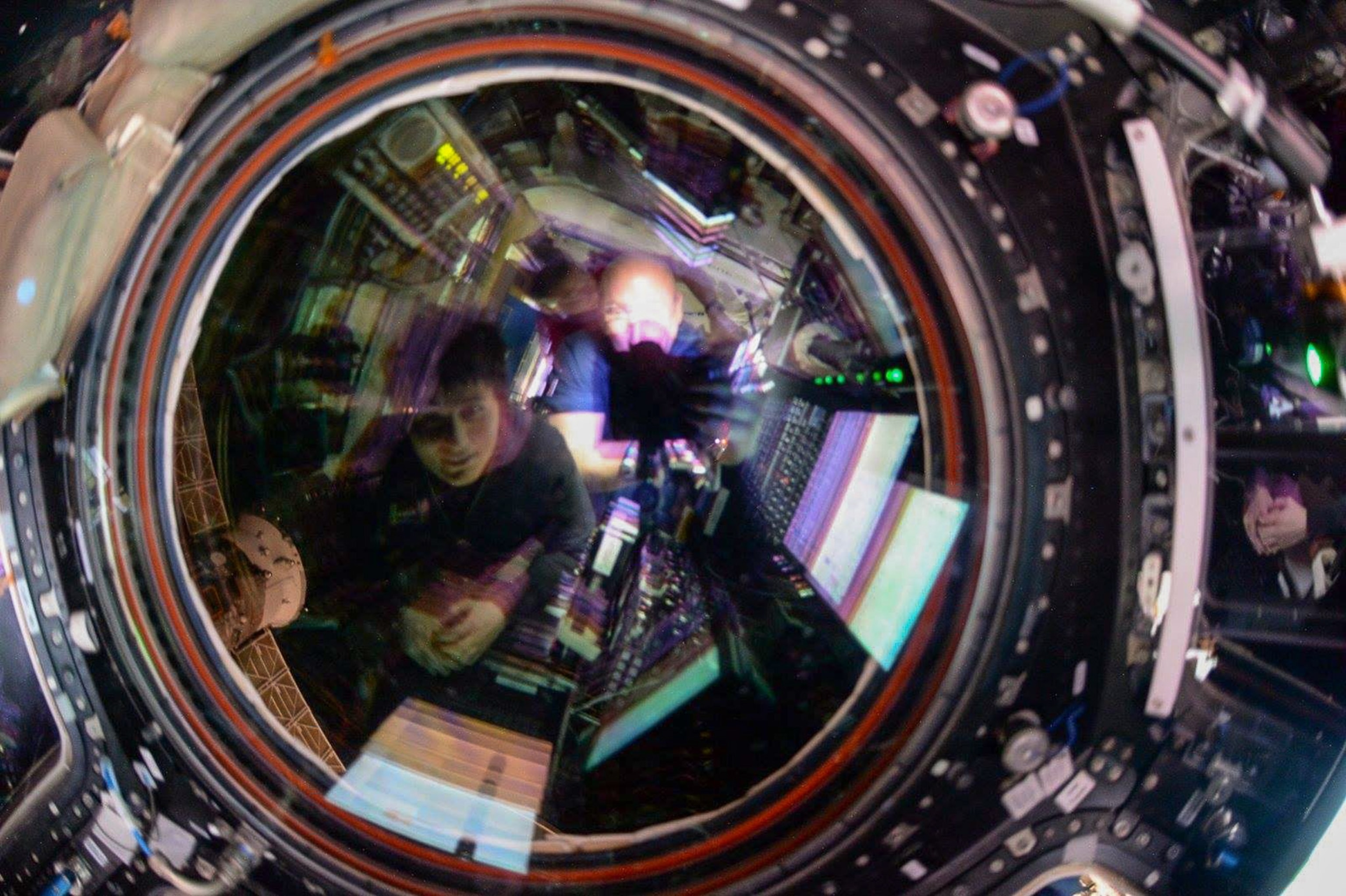 astronauts receiving supplies on the International Space Station