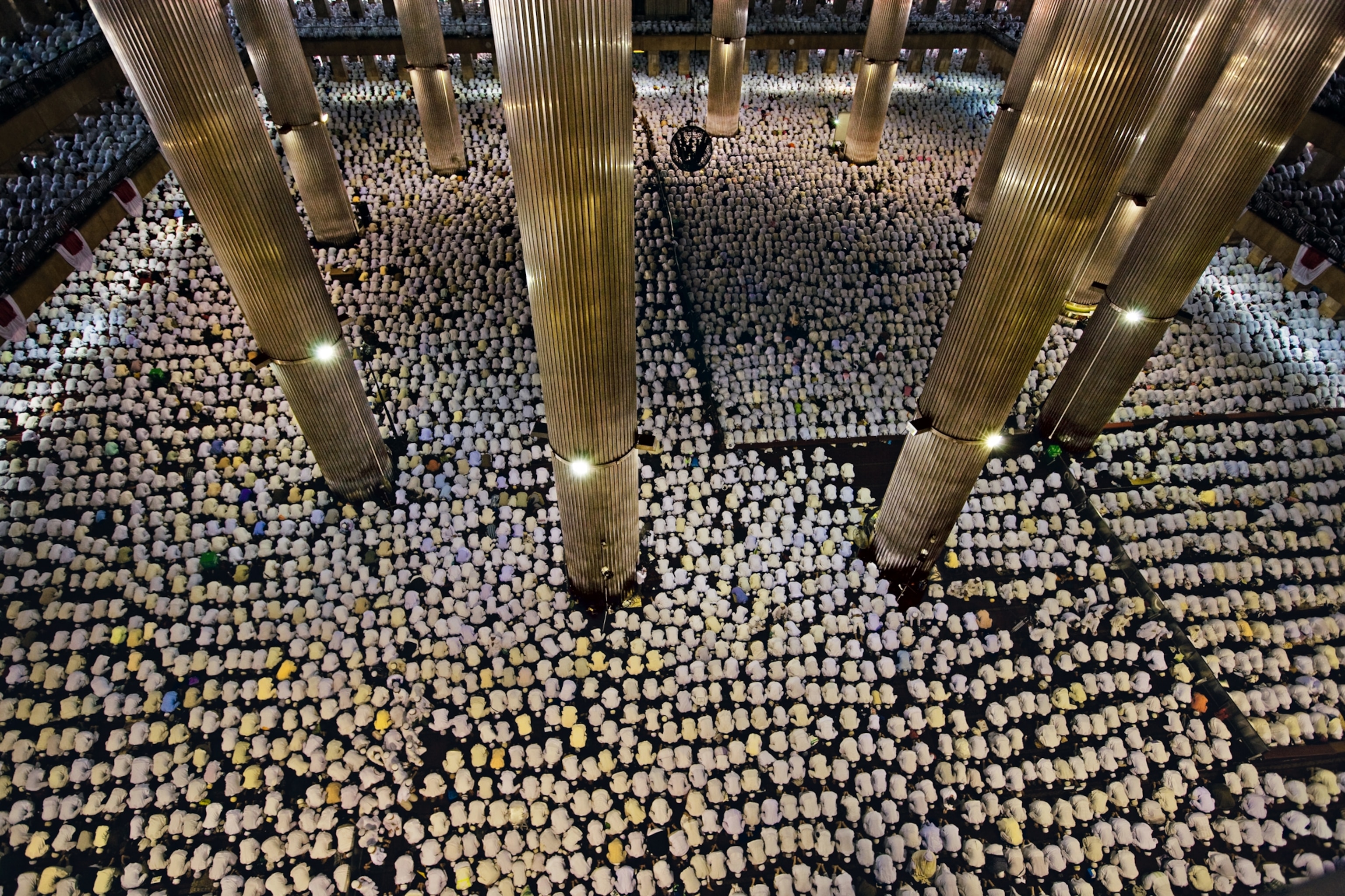 thousands of worshippers praying at the National Mosque in Jakarta