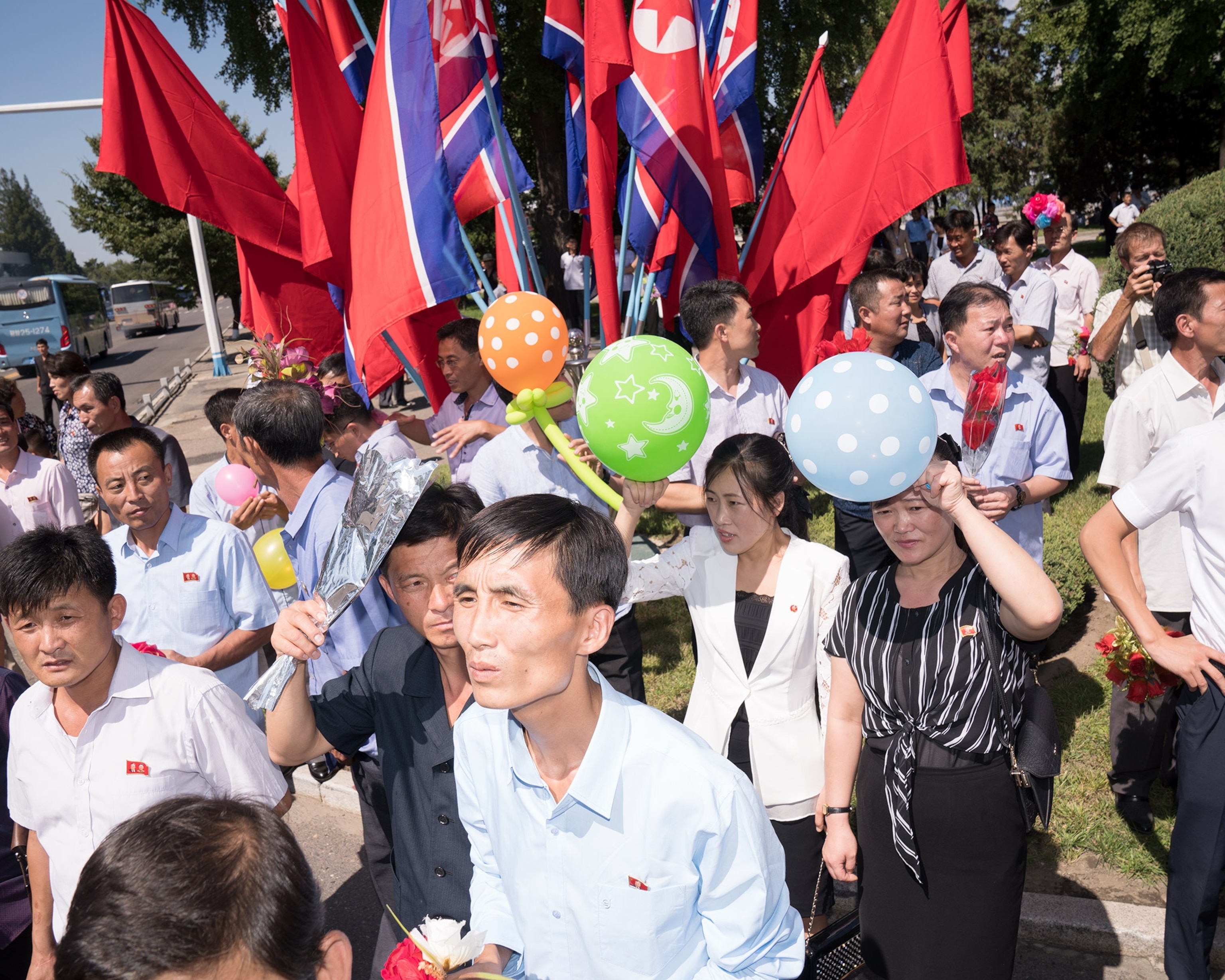 people participating the parade for the 70th anniversary of North Korea