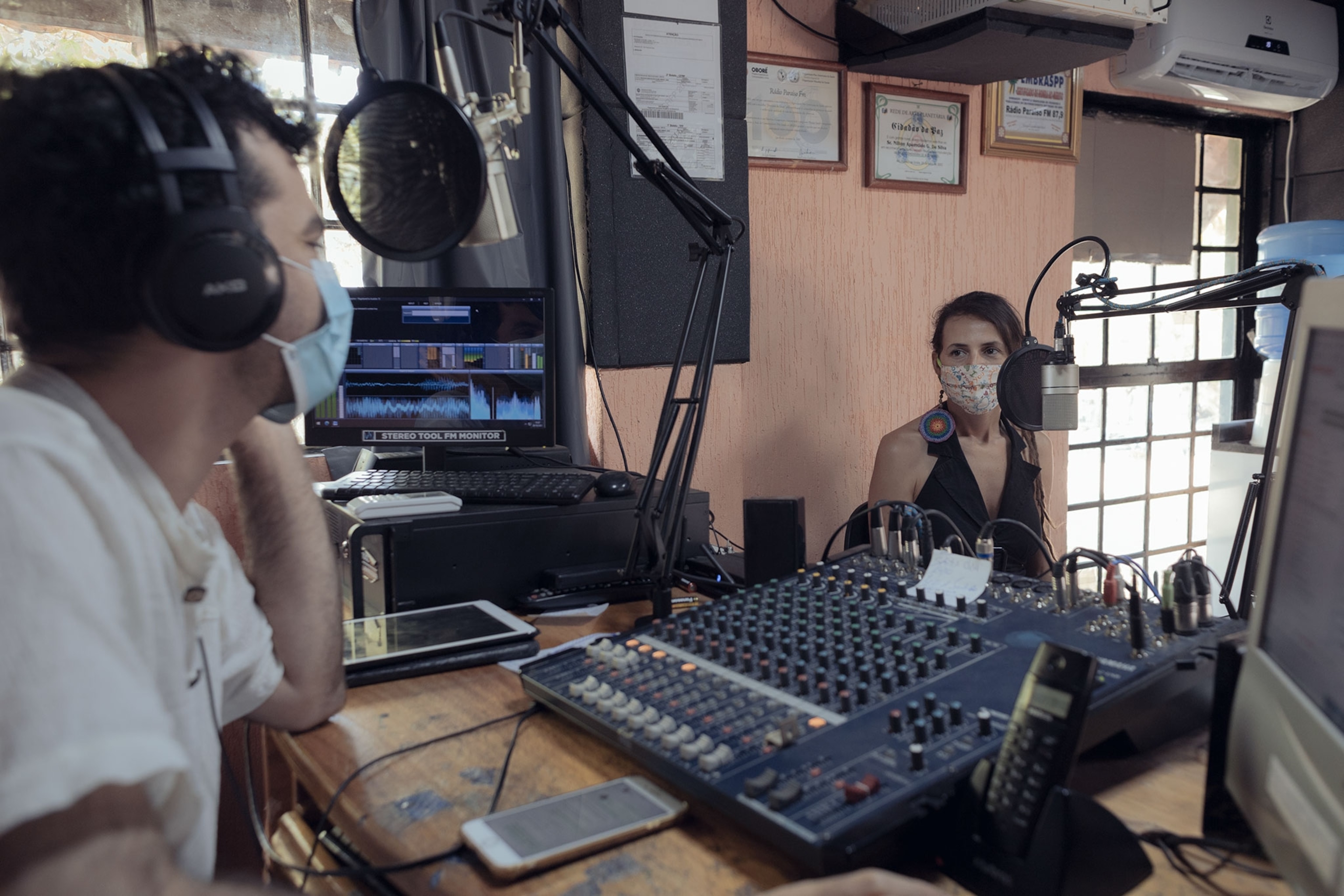 a co-councilor of a political collective in Brazil does a radio interview