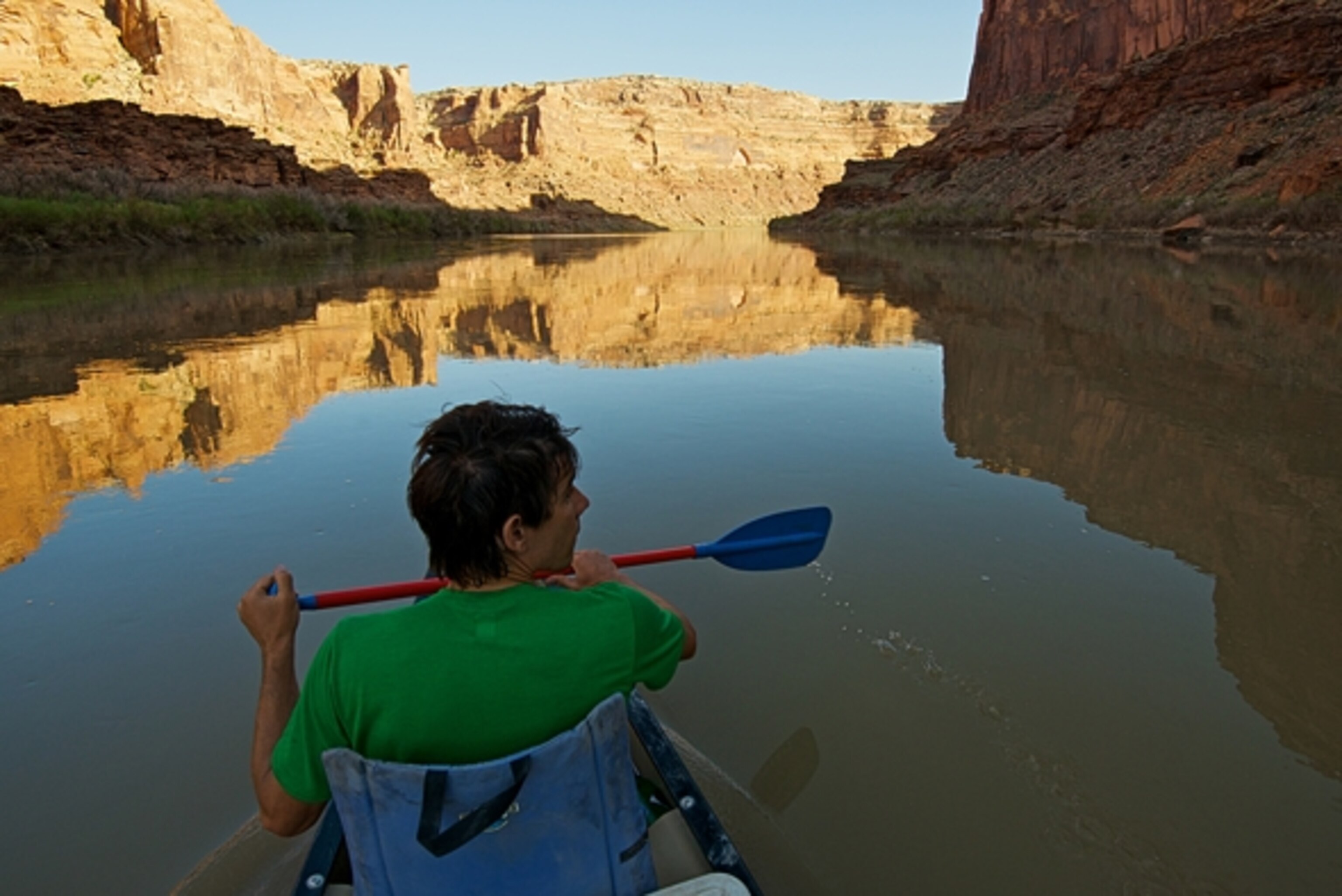 Alex Honnold paddling the Green River in Labyrinth Canyon, UT in search of unclimbed crack. Photograph by Celin Serbo