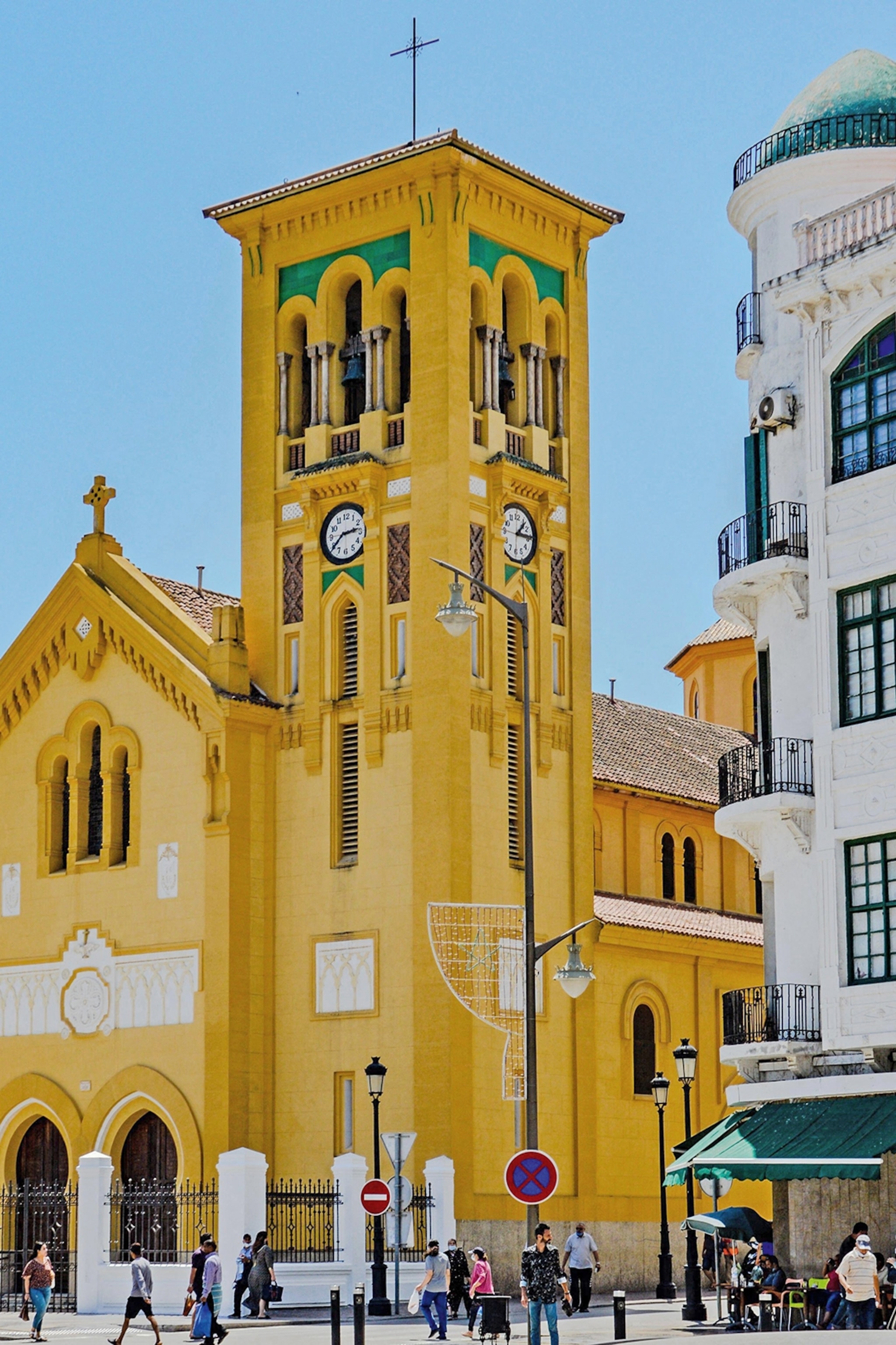 A colourful church on a busy street in Morocco.