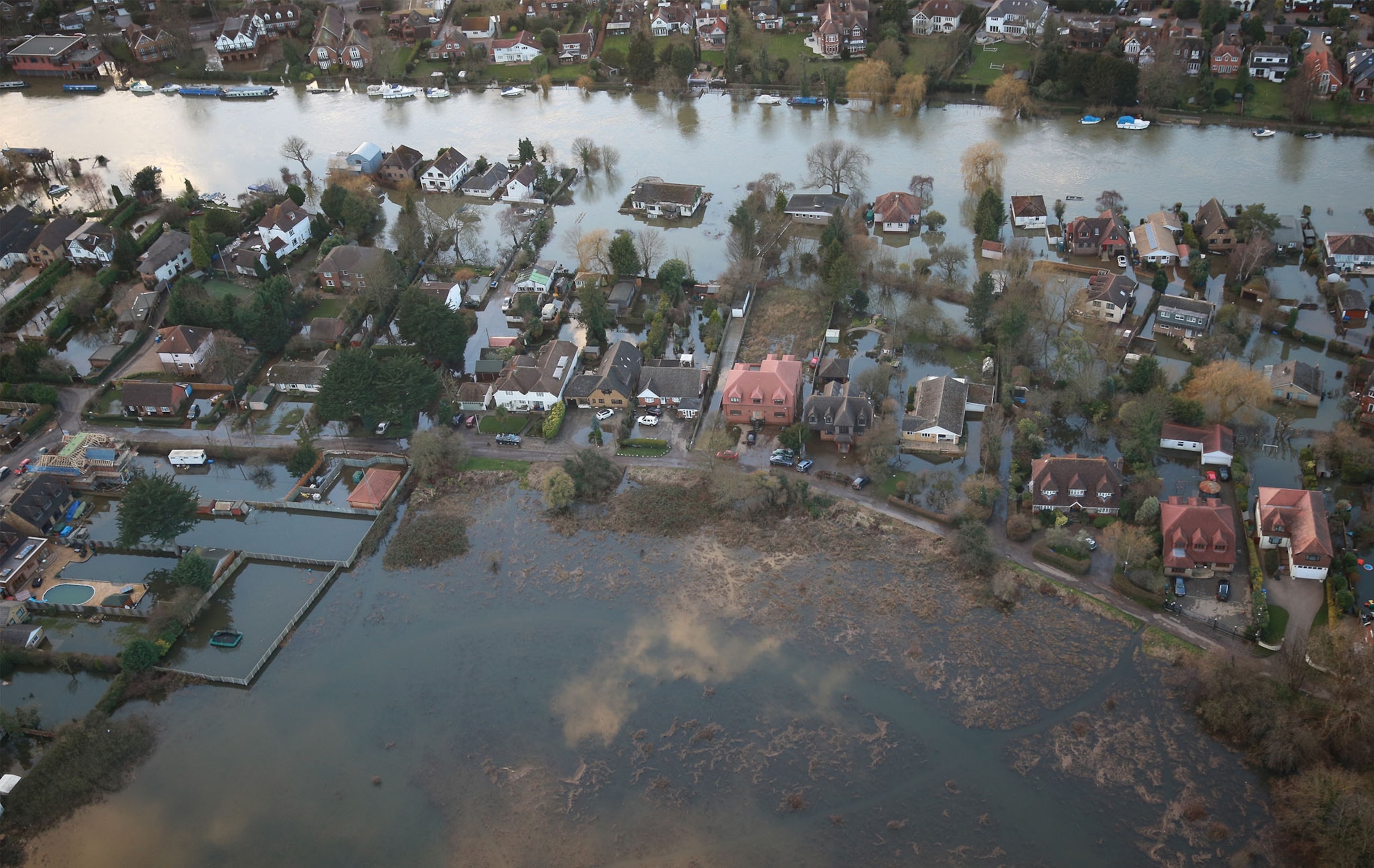 Properties near to the river Thames are inundated with flood water on February 16, 2014 in Wraysbury, England. Housing near the river Thames has suffered a week of flooding after the river burst it's banks on February 10, 2014.