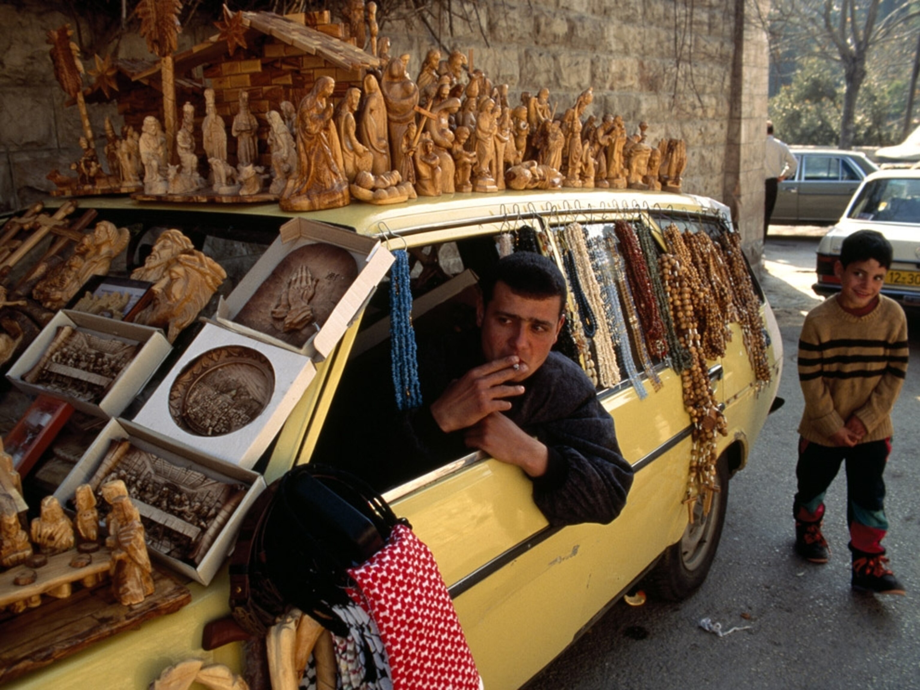 Car covered with religious wood carvings
