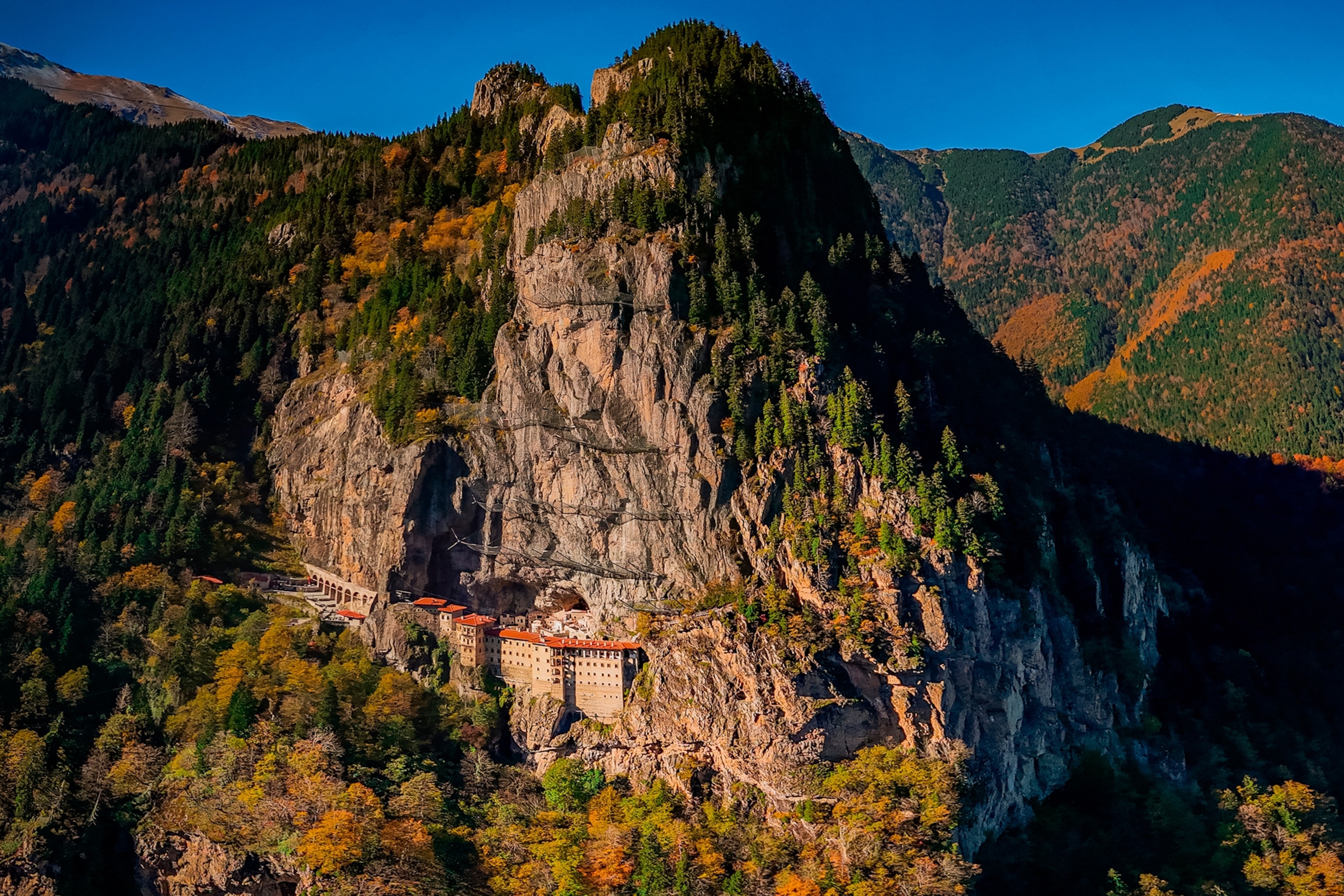 Monastery beneath high mountain.