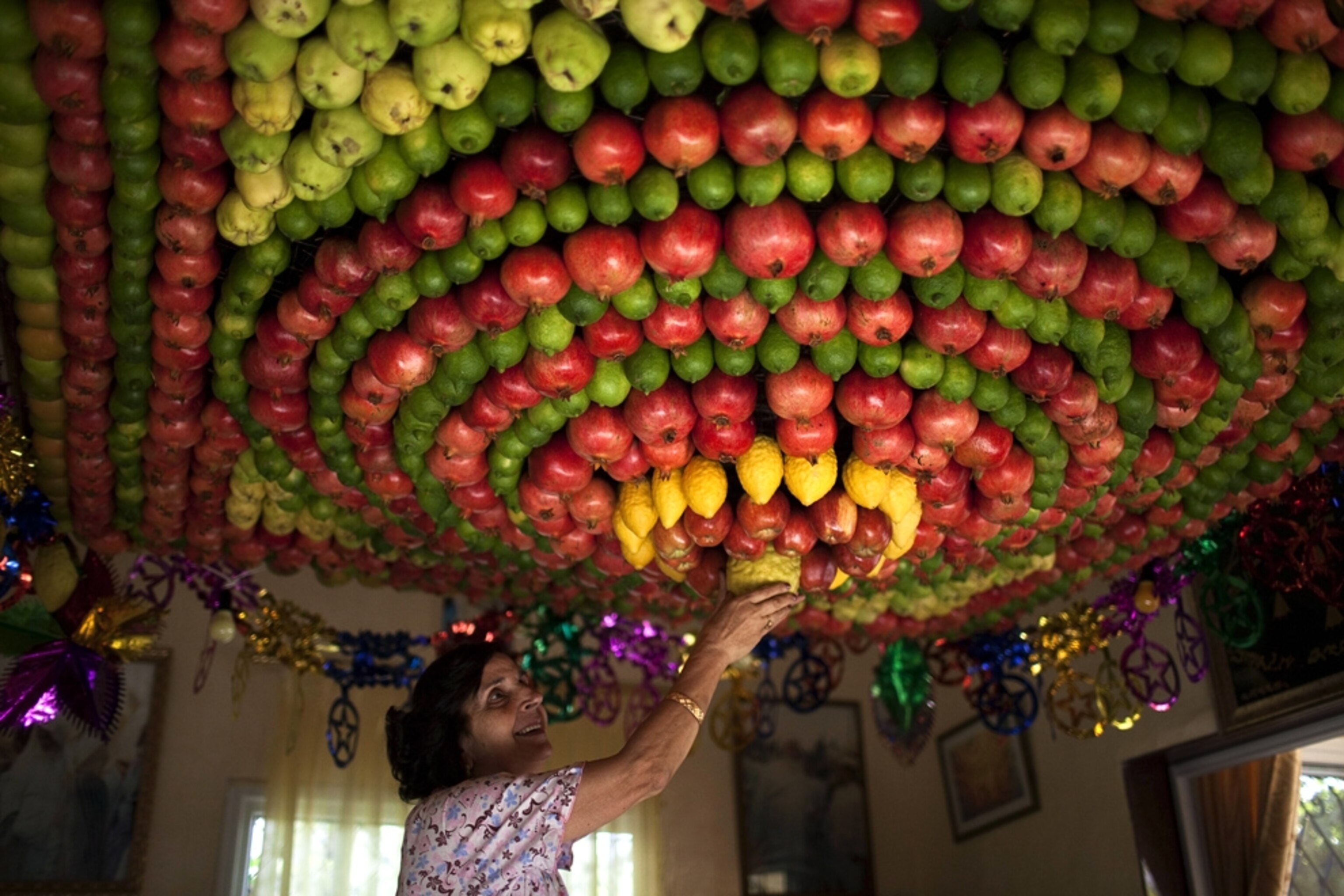 West Bank picture: woman preparing for Sukkot holiday -- for best pictures of October photo gallery
