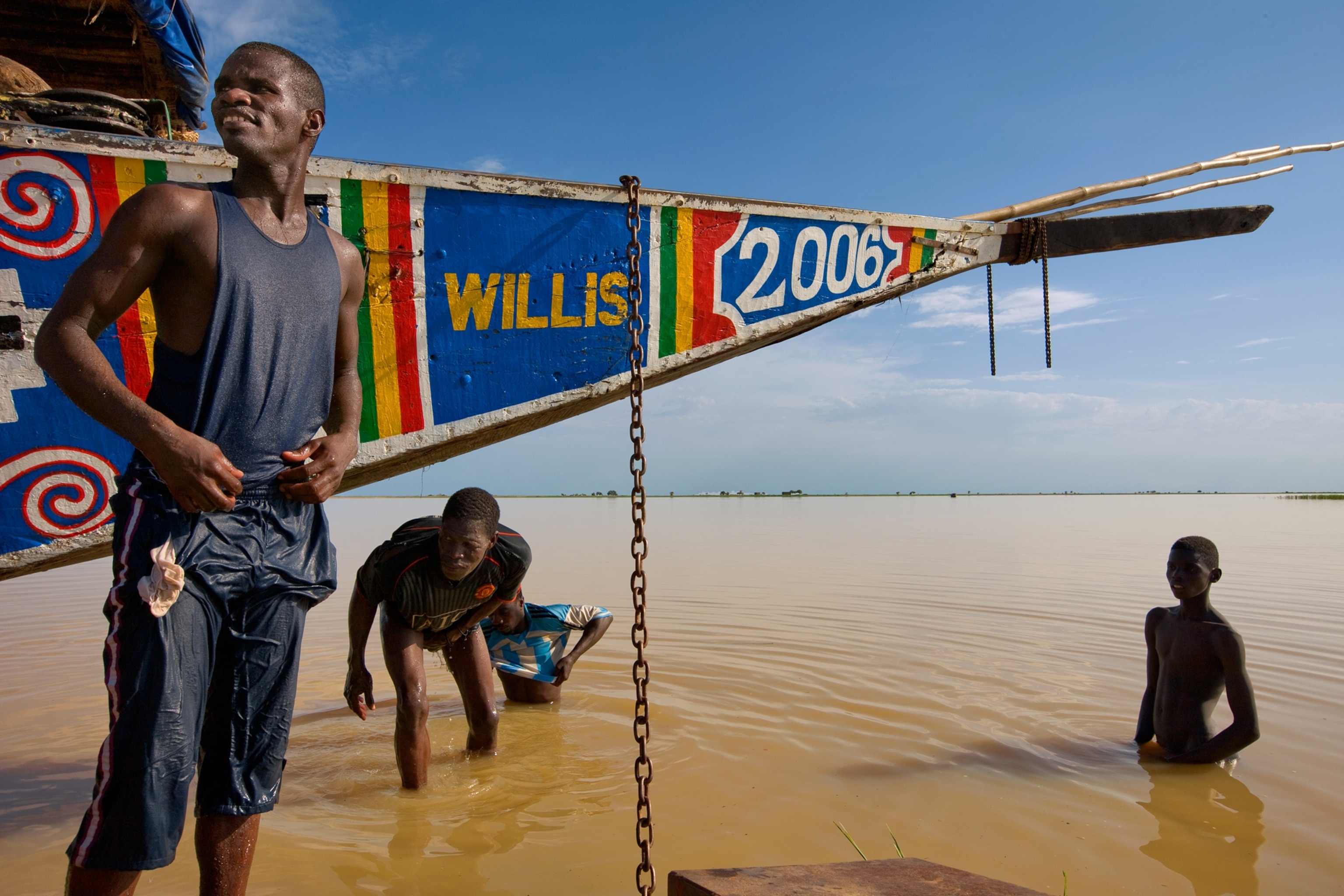 Niger River picture - Young men take a swim in the muddy Niger River