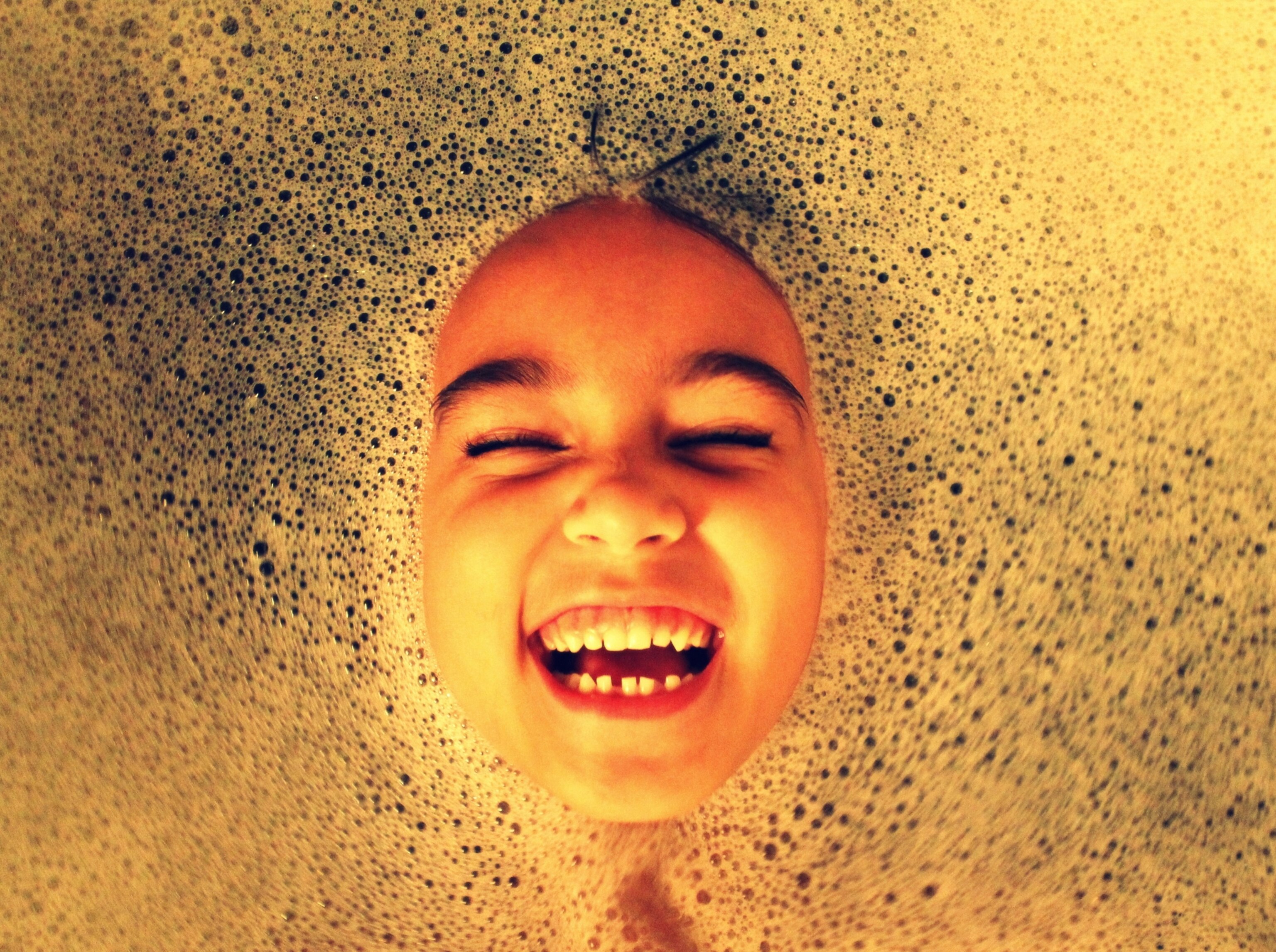 a young girl in a bubble bath