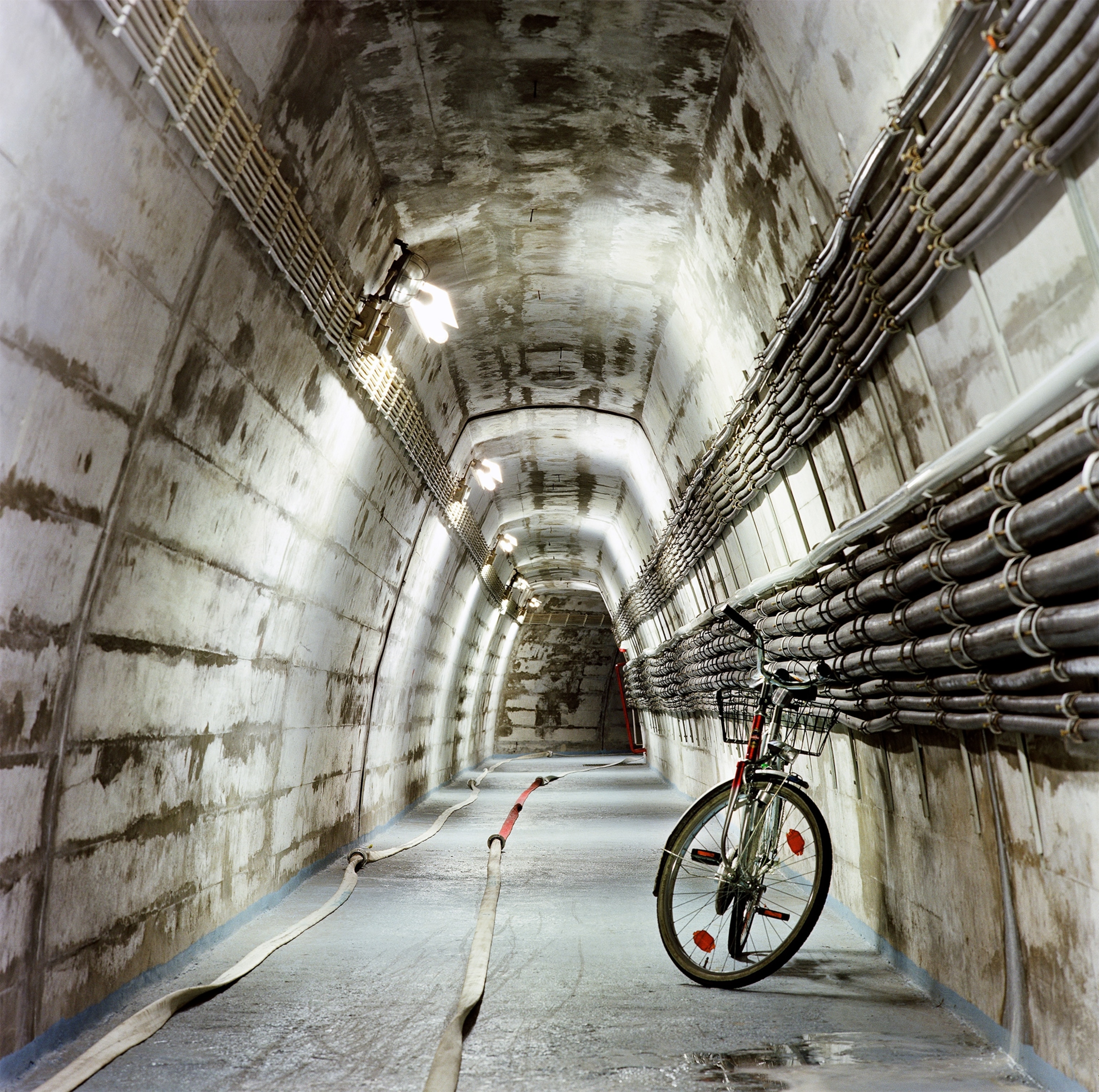 a bicycle standing in a tunnel in the former nuclear bunker complex for the West German government.