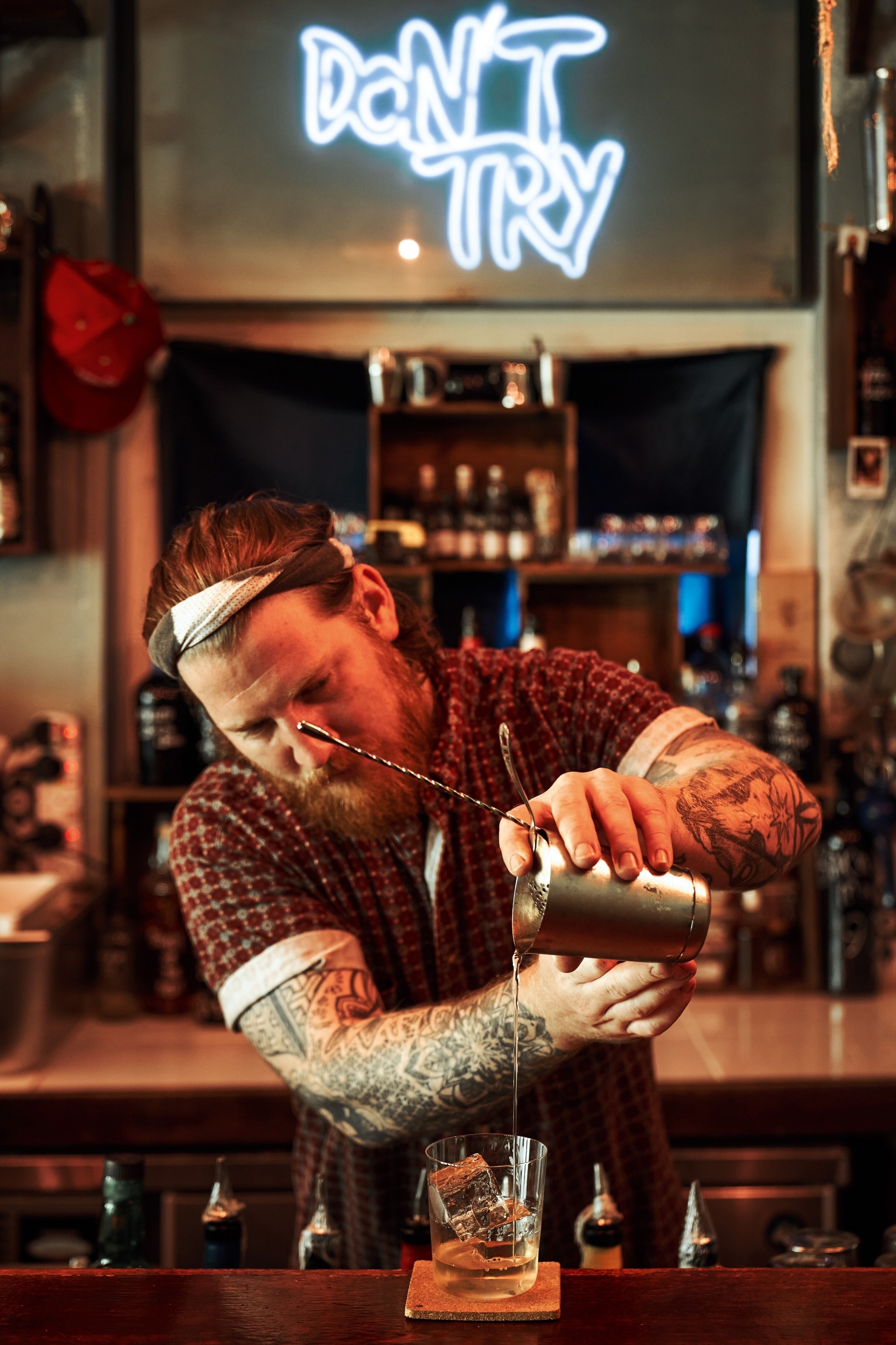 Jay Gray making a cocktail at Sago House, a buzzy watering hole in Chinatown.