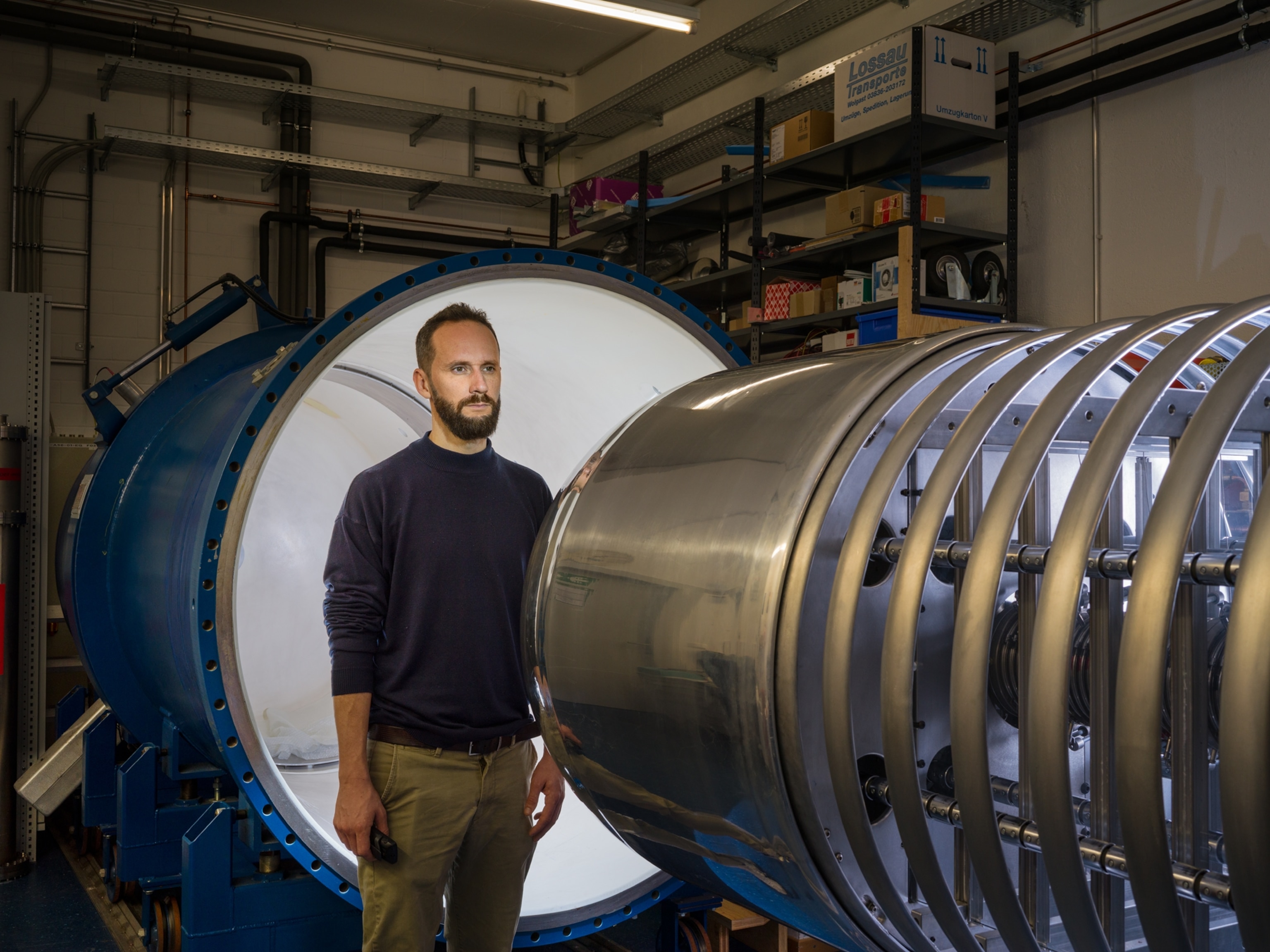 man standing in front of machines