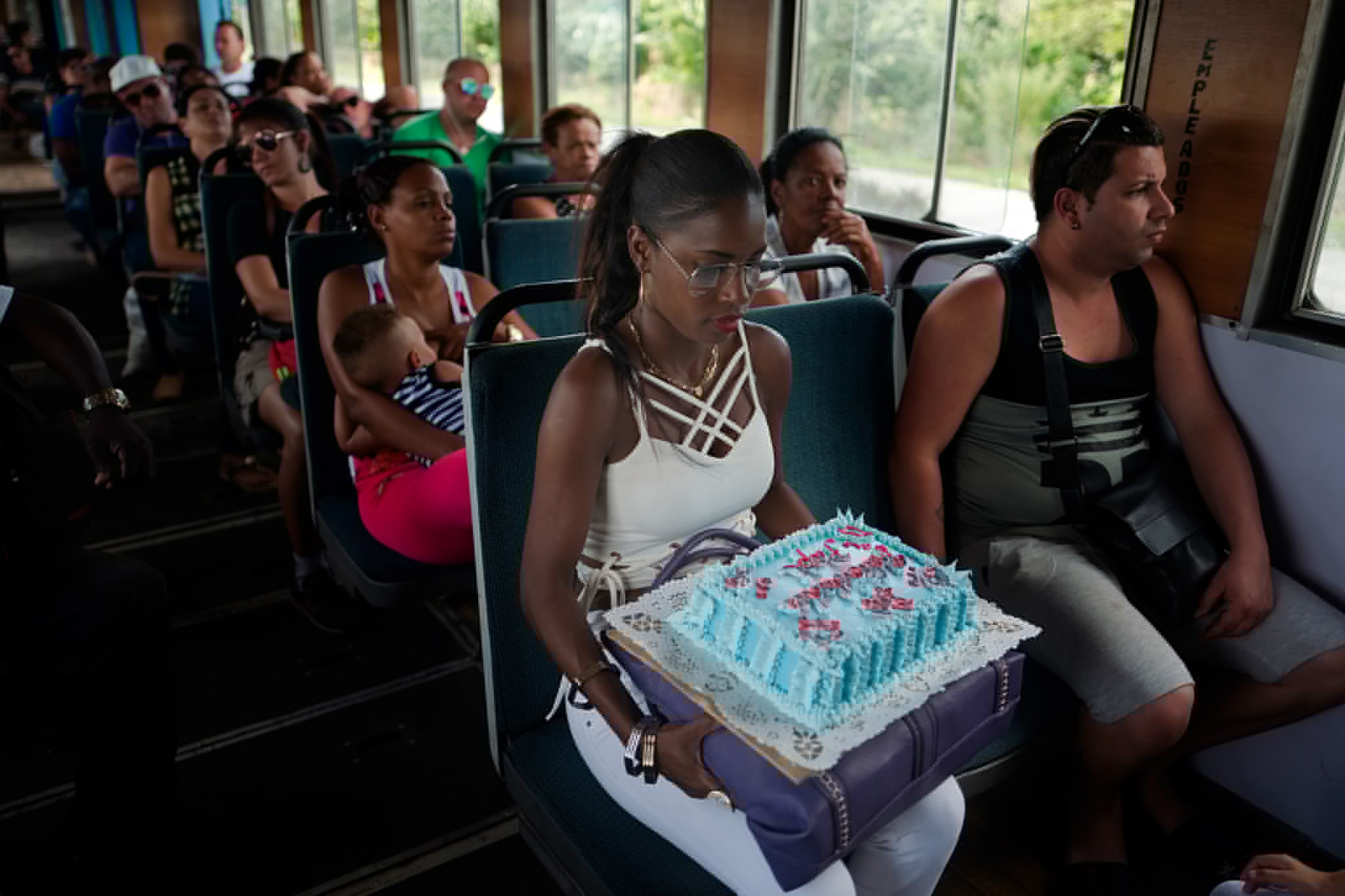 passengers on a train in Cuba