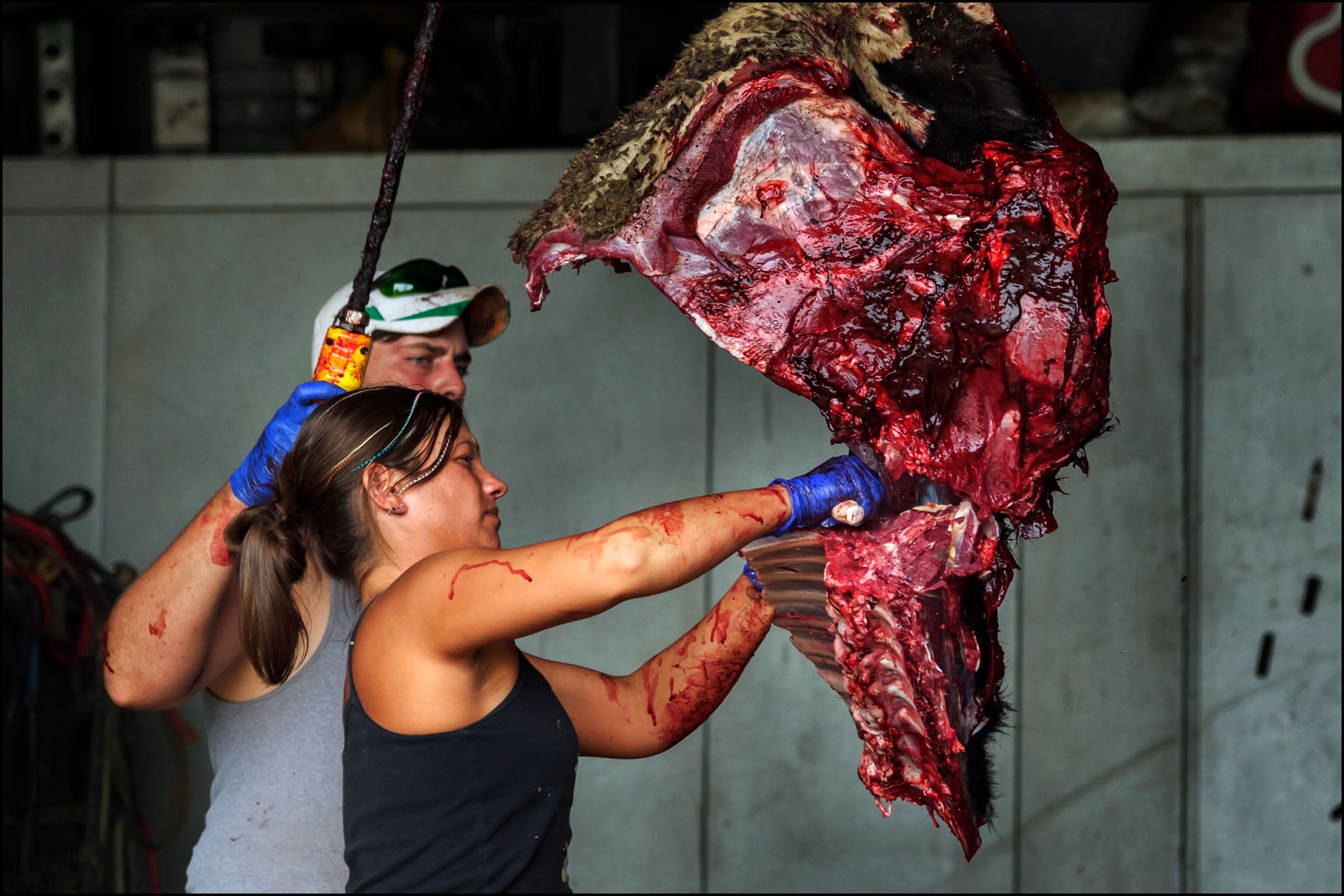 woman butchering meat