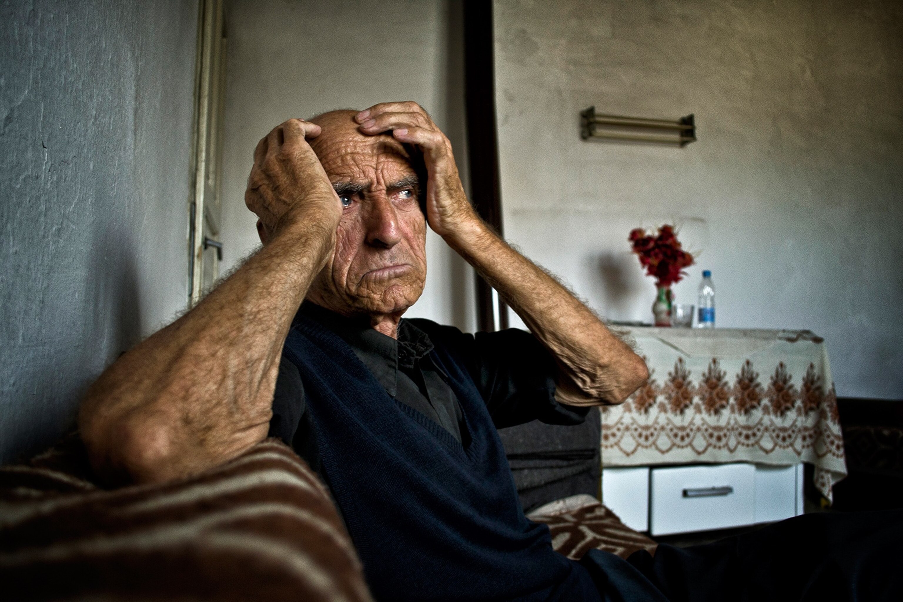 a man with his hands on his head