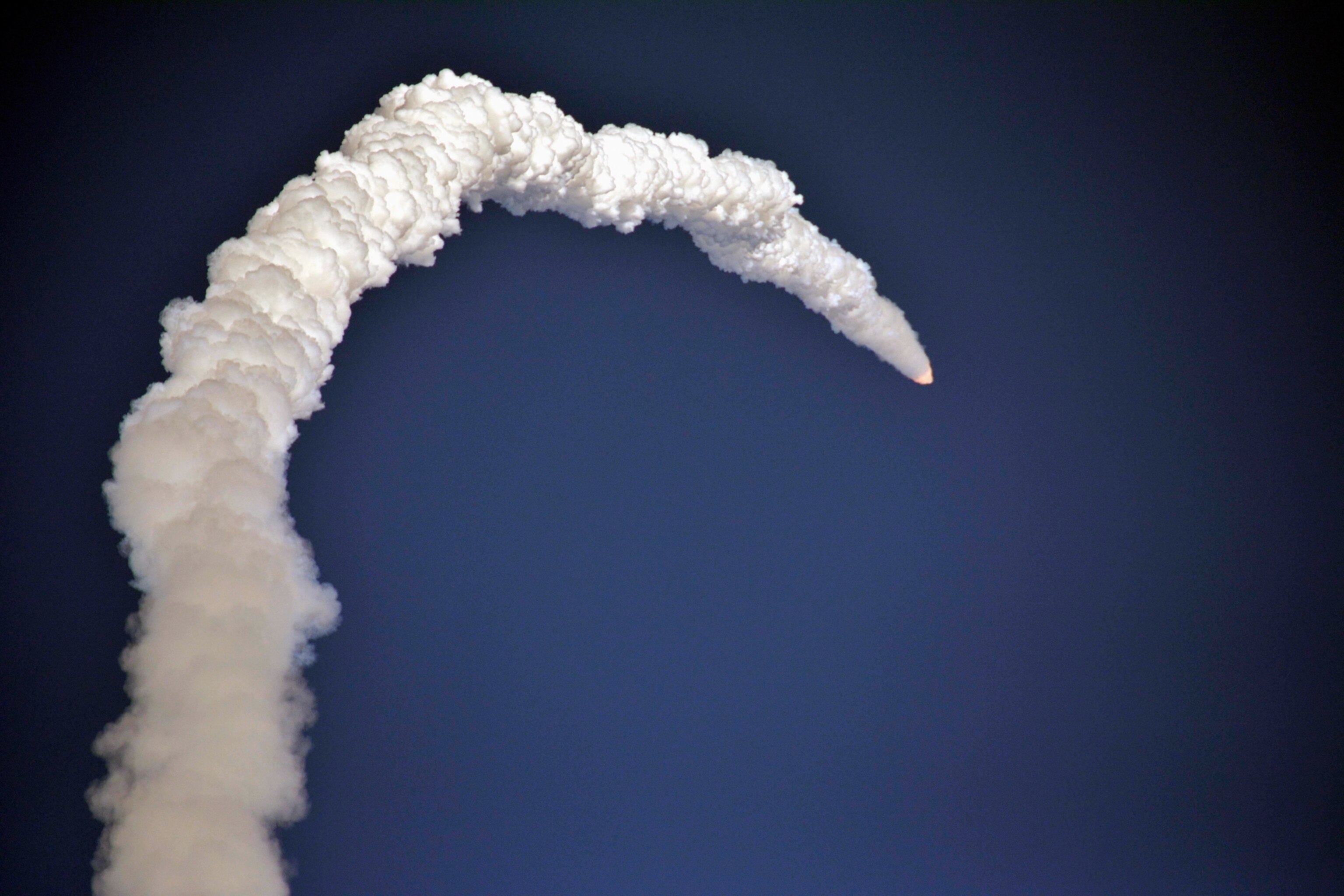 a satellite lifting off from a space center in India