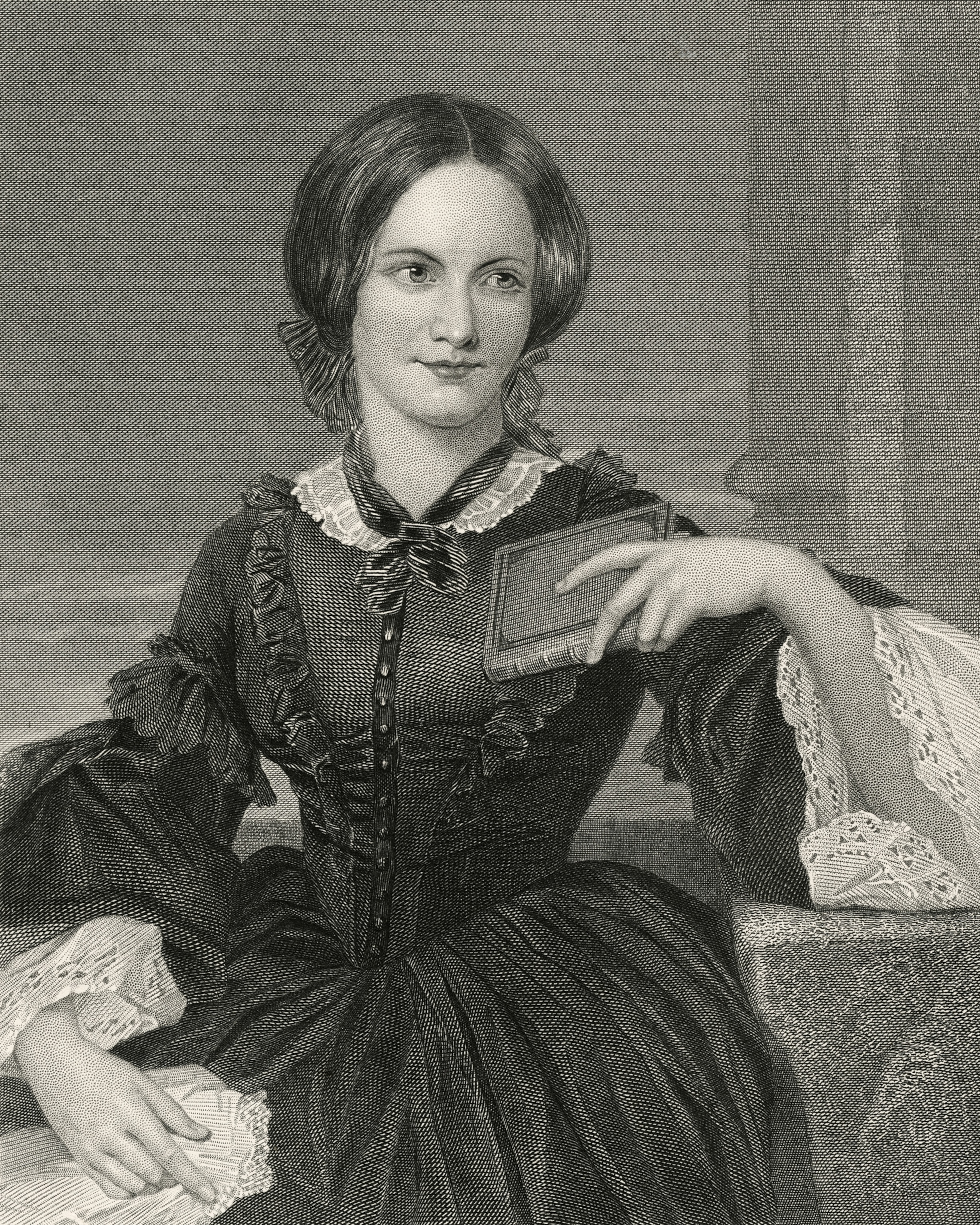 Engraving of a seated woman in Victorian attire, holding a book. She gazes thoughtfully into the distance
