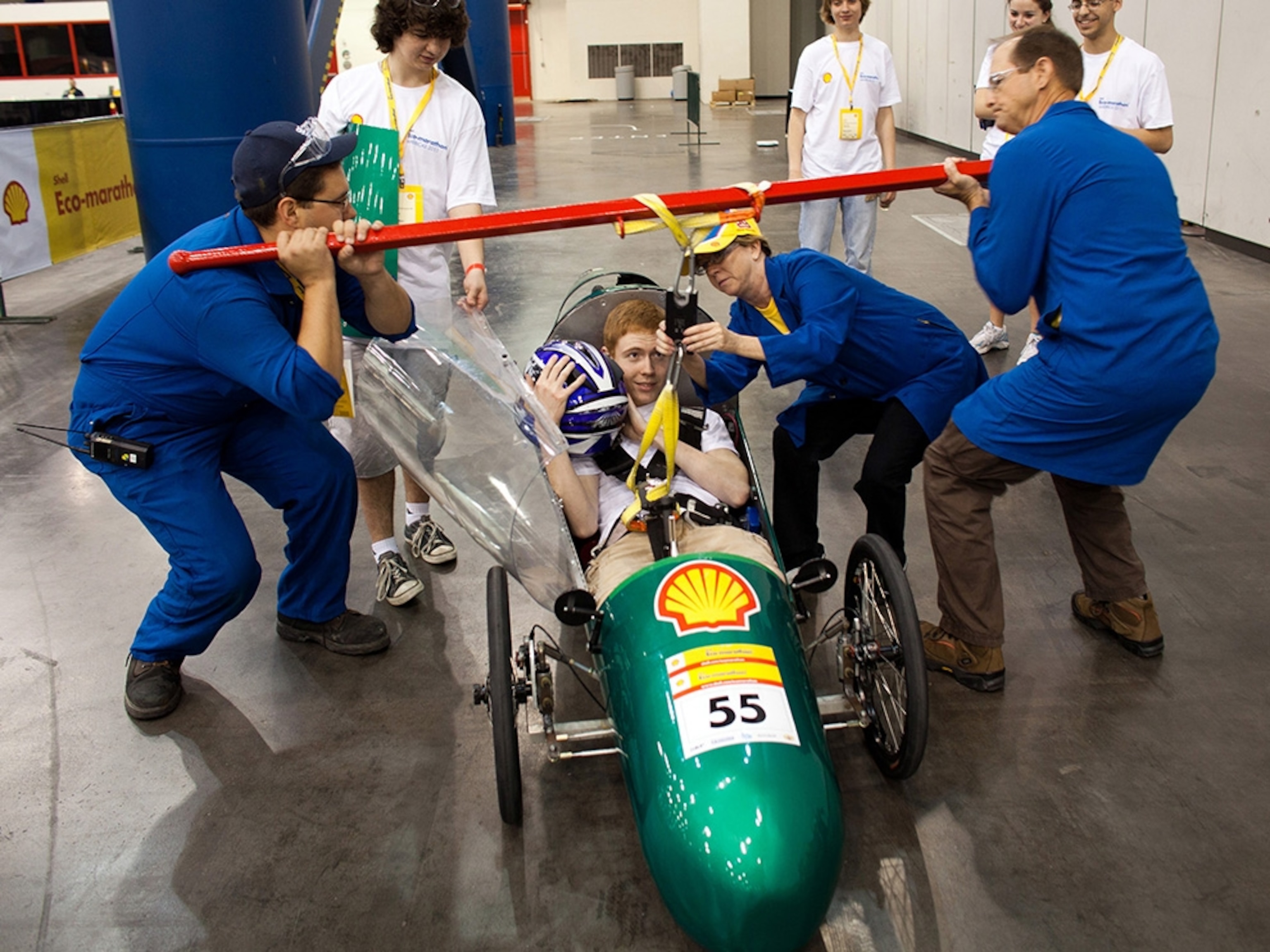 Erik Avery and the Cicero North Syracuse (N.Y.) High School prototype car are lifted by the seat belt harness during technical tests.