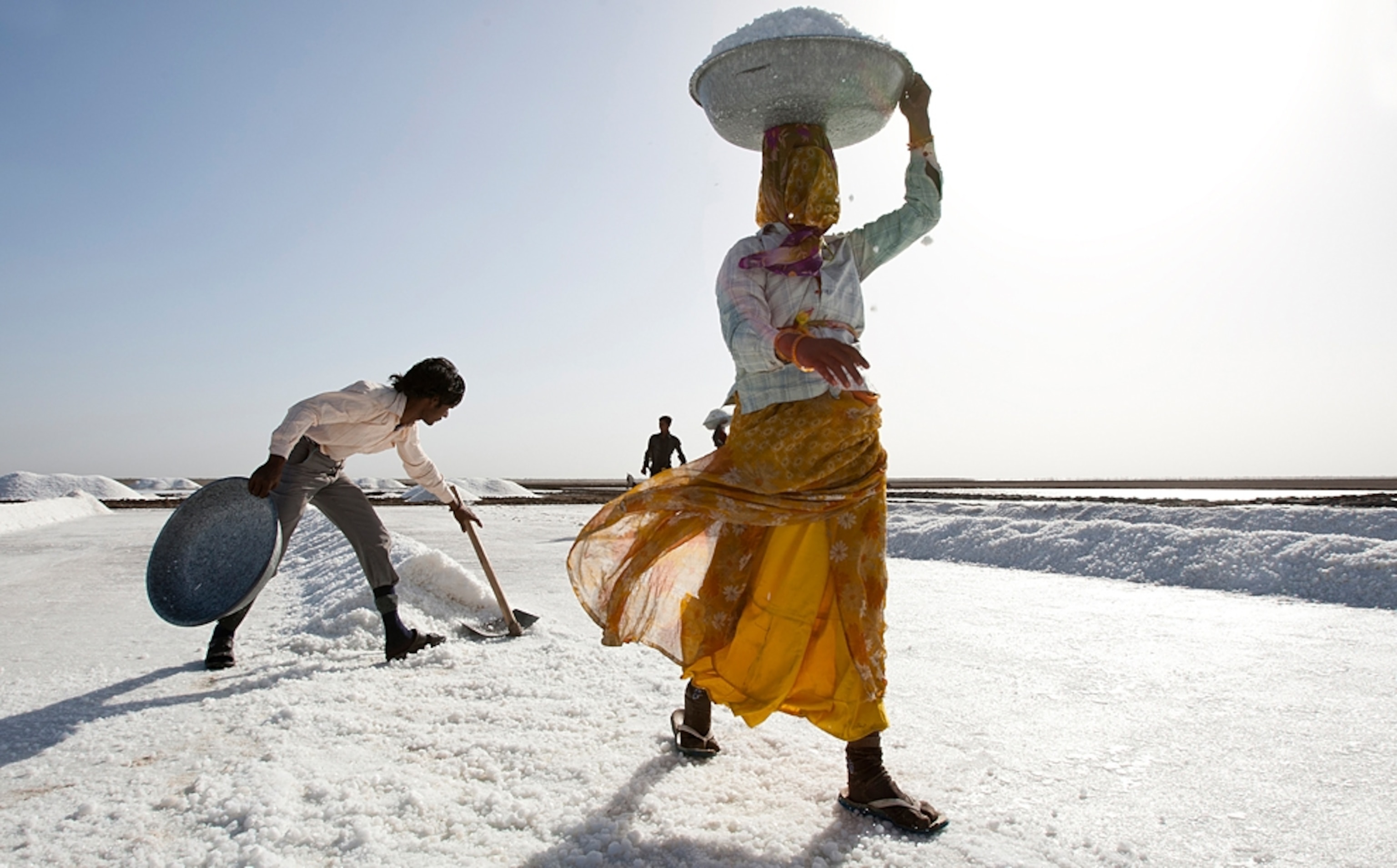 a woman carrying salt in Little Desert of Kutch, India