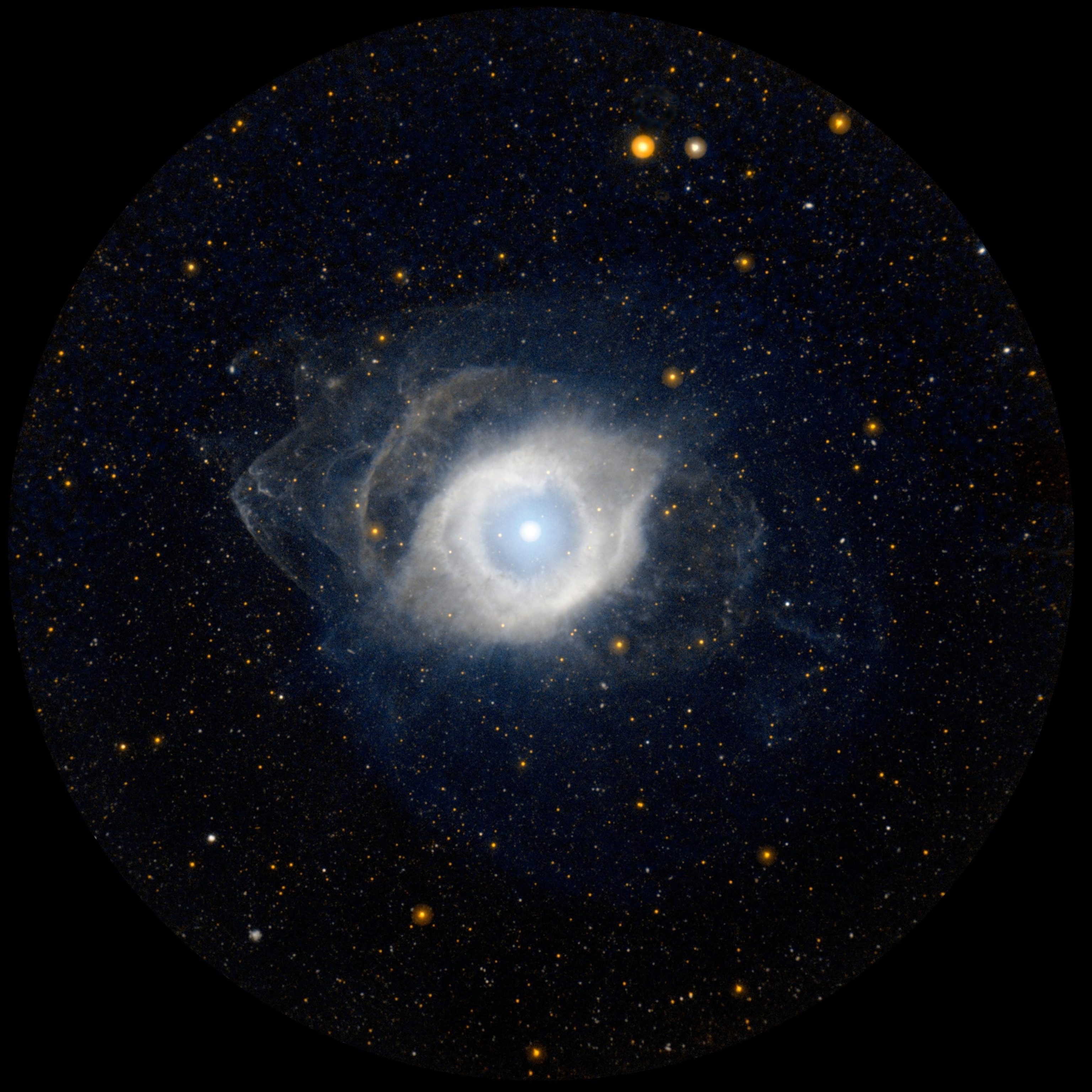 NGC 7293, better known as the Helix nebula, displays its ultraviolet glow courtesy of NASA's Galaxy Evolution Explorer (GALEX).