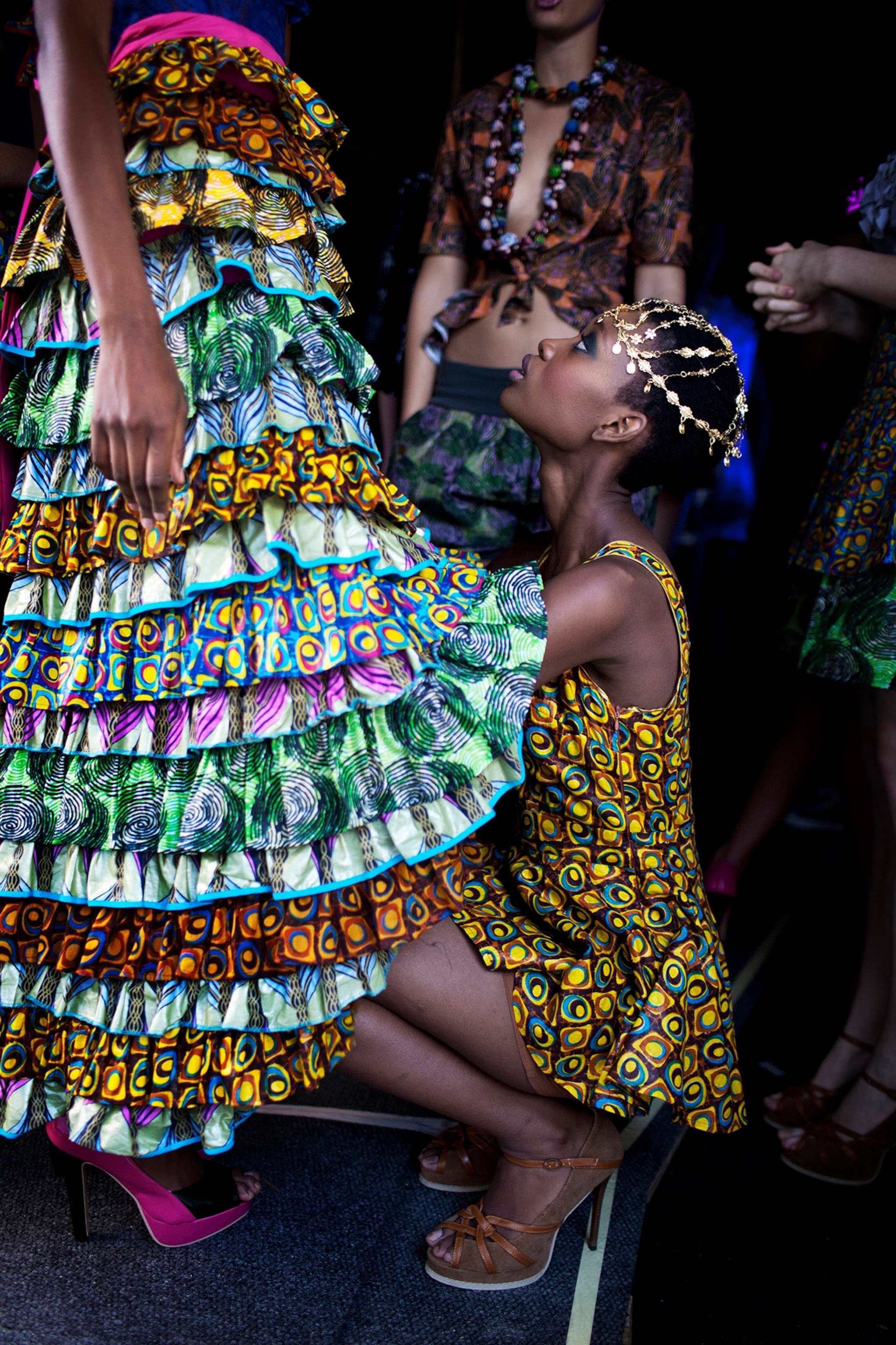 Models wait backstage before a show with designer Liz Ogumbo at Joburg Fashion Week.