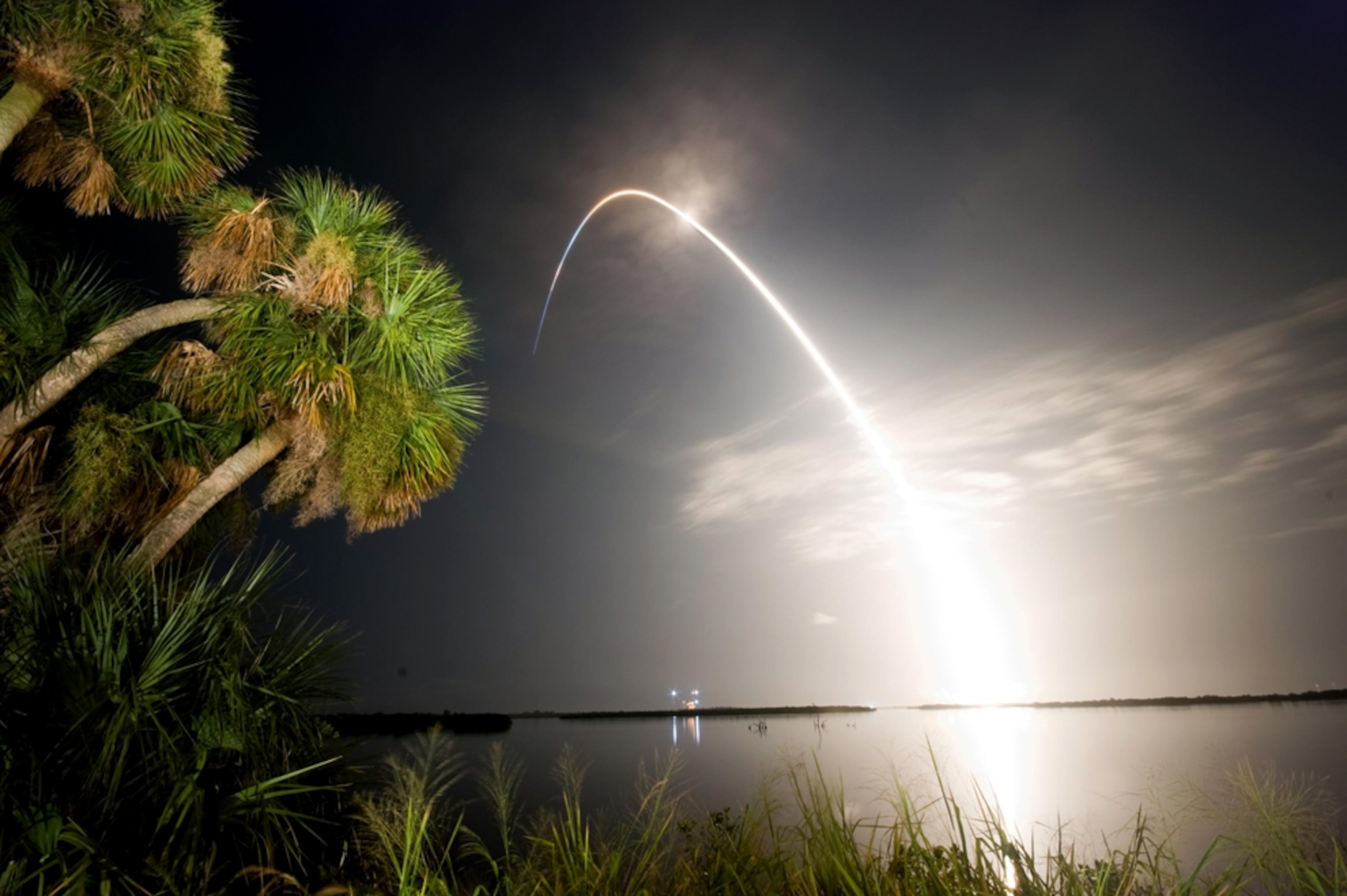 the trail of the NASA space shuttle Discovery during a successful night launch.