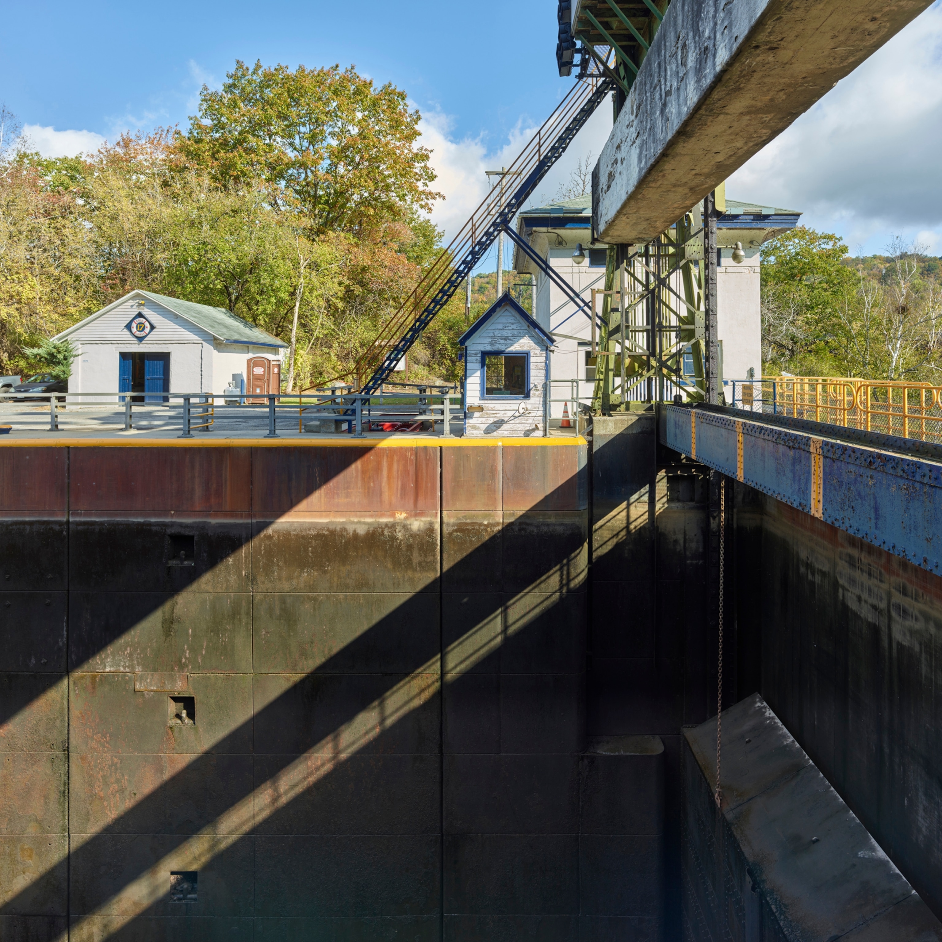 Lock E17, Little Falls. View of the lift gate, operator's control booth, lockhouse (right background), and shop (left background), Erie Canal, New York.
