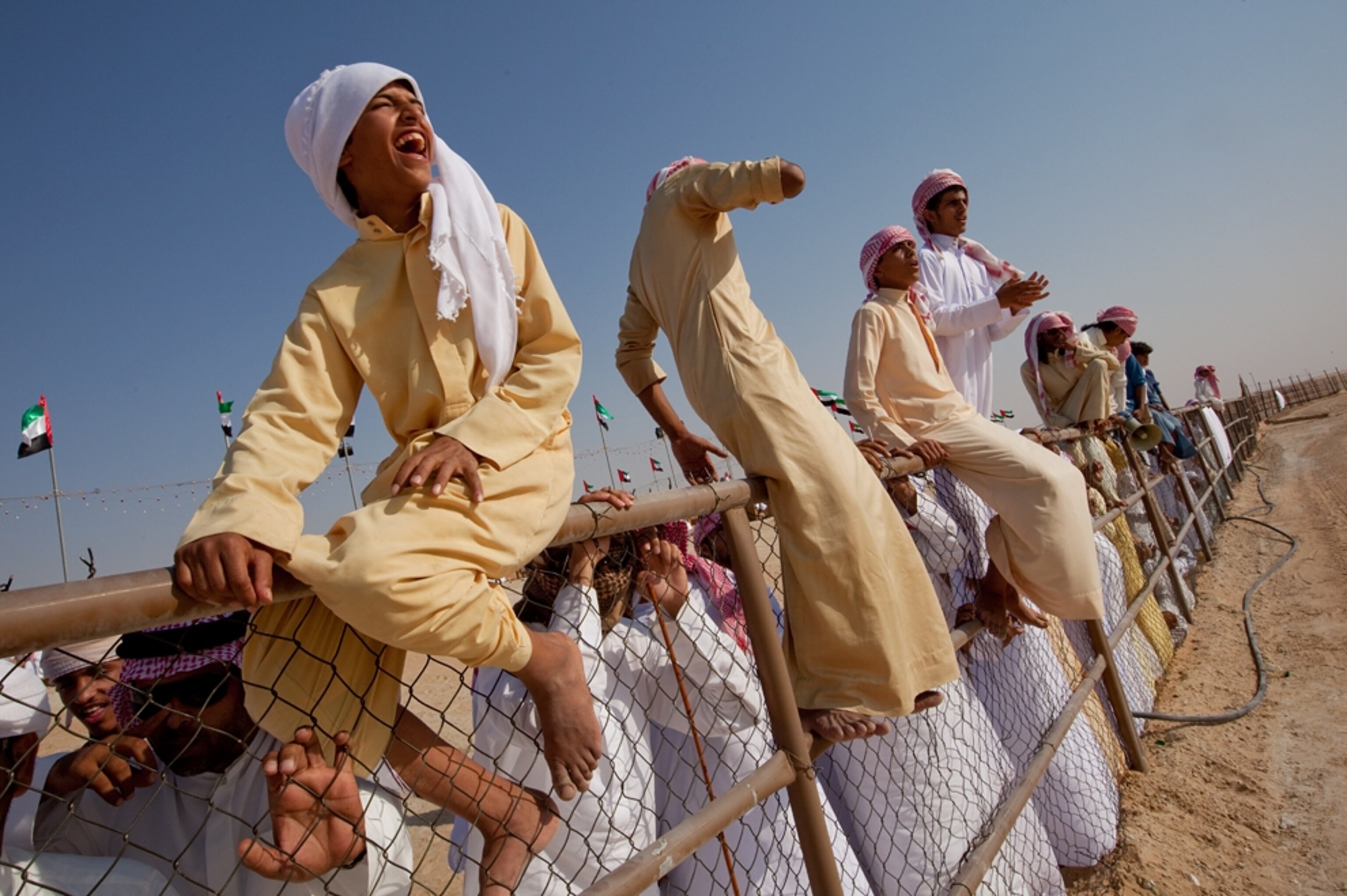 Spectators at the camel beauty contest cheer